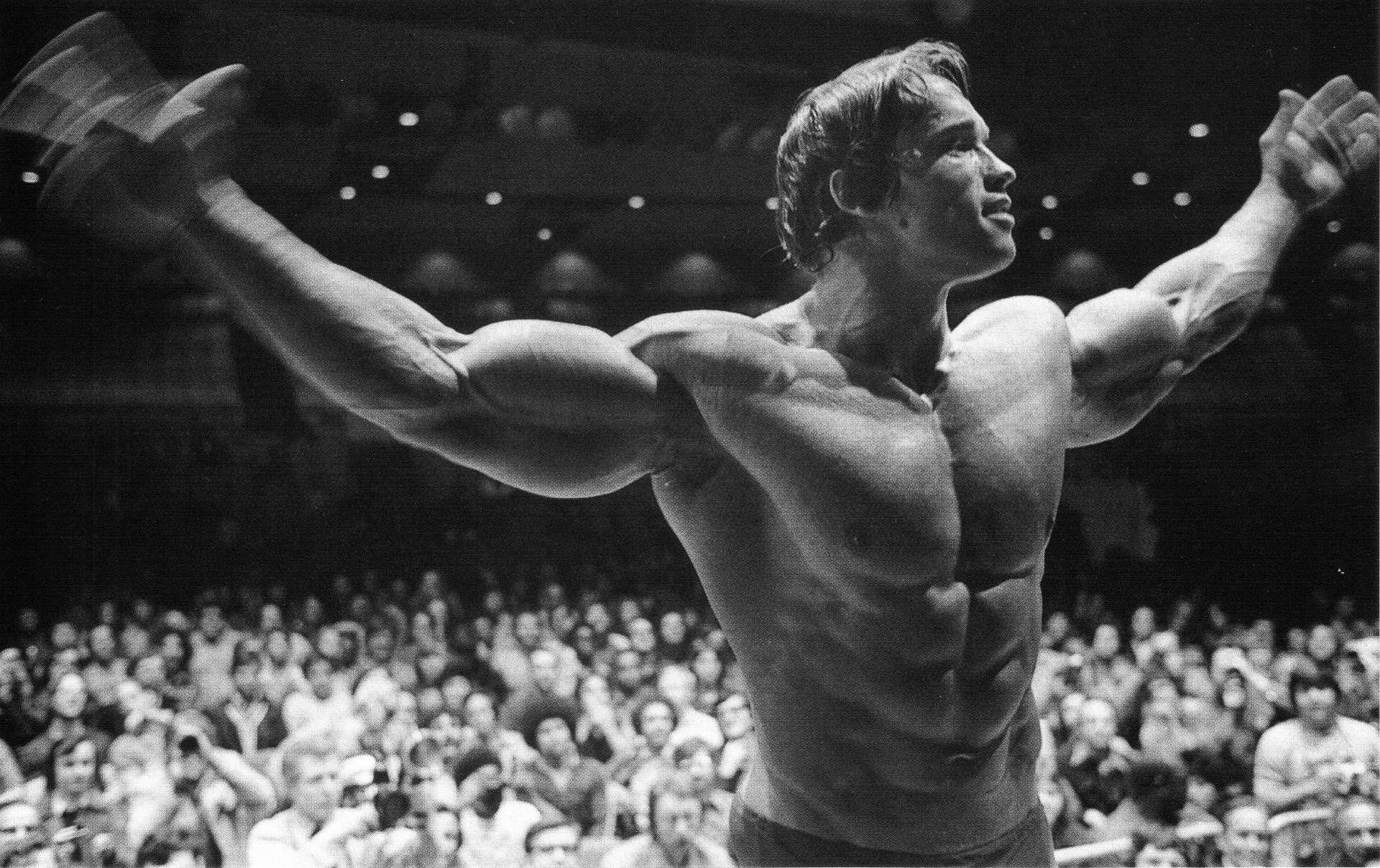 Arnold Schwarzenegger posing in Mr. Olympia HD Wallpaper