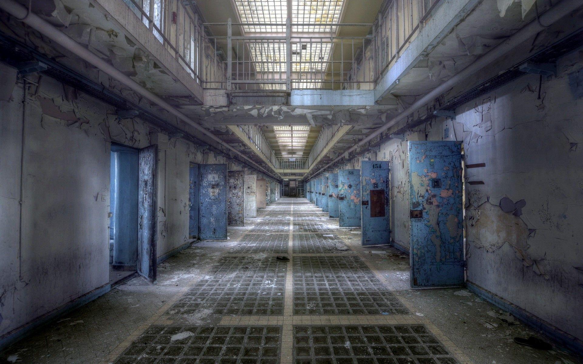 The interior of an abandoned prison wallpaper and image