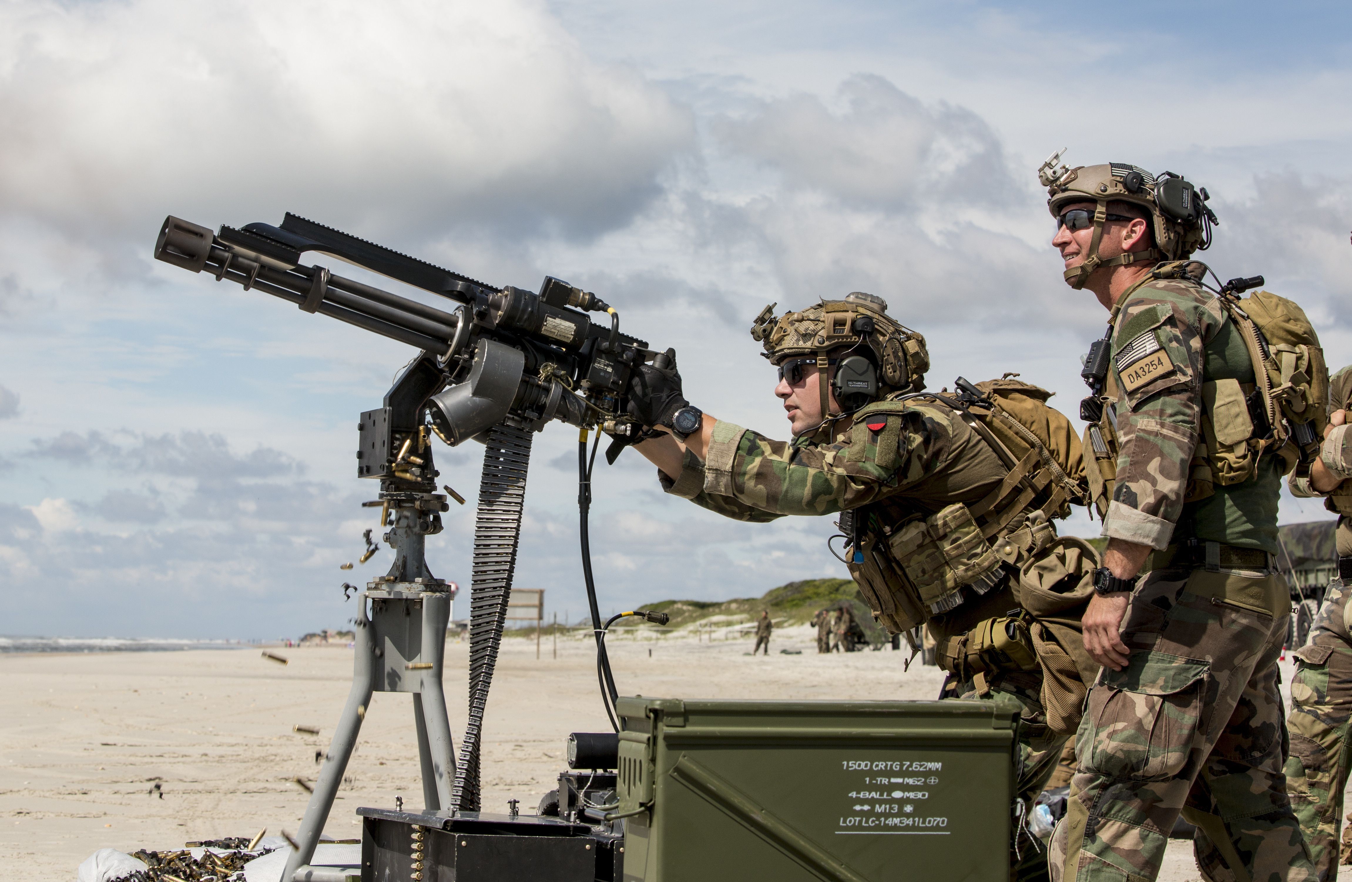 U.S. Marine Raider firing a minigun during a live fire exercise