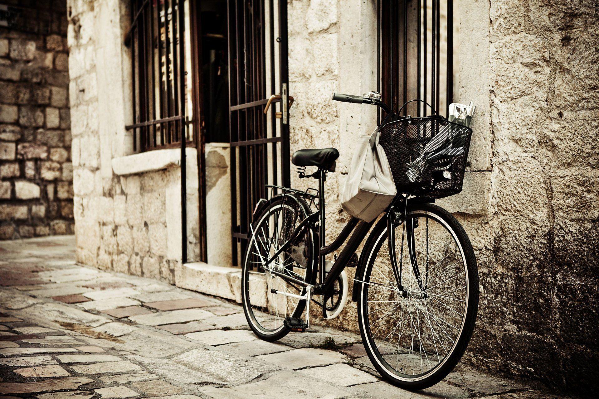 mood bike wheel shopping basket town street brick background