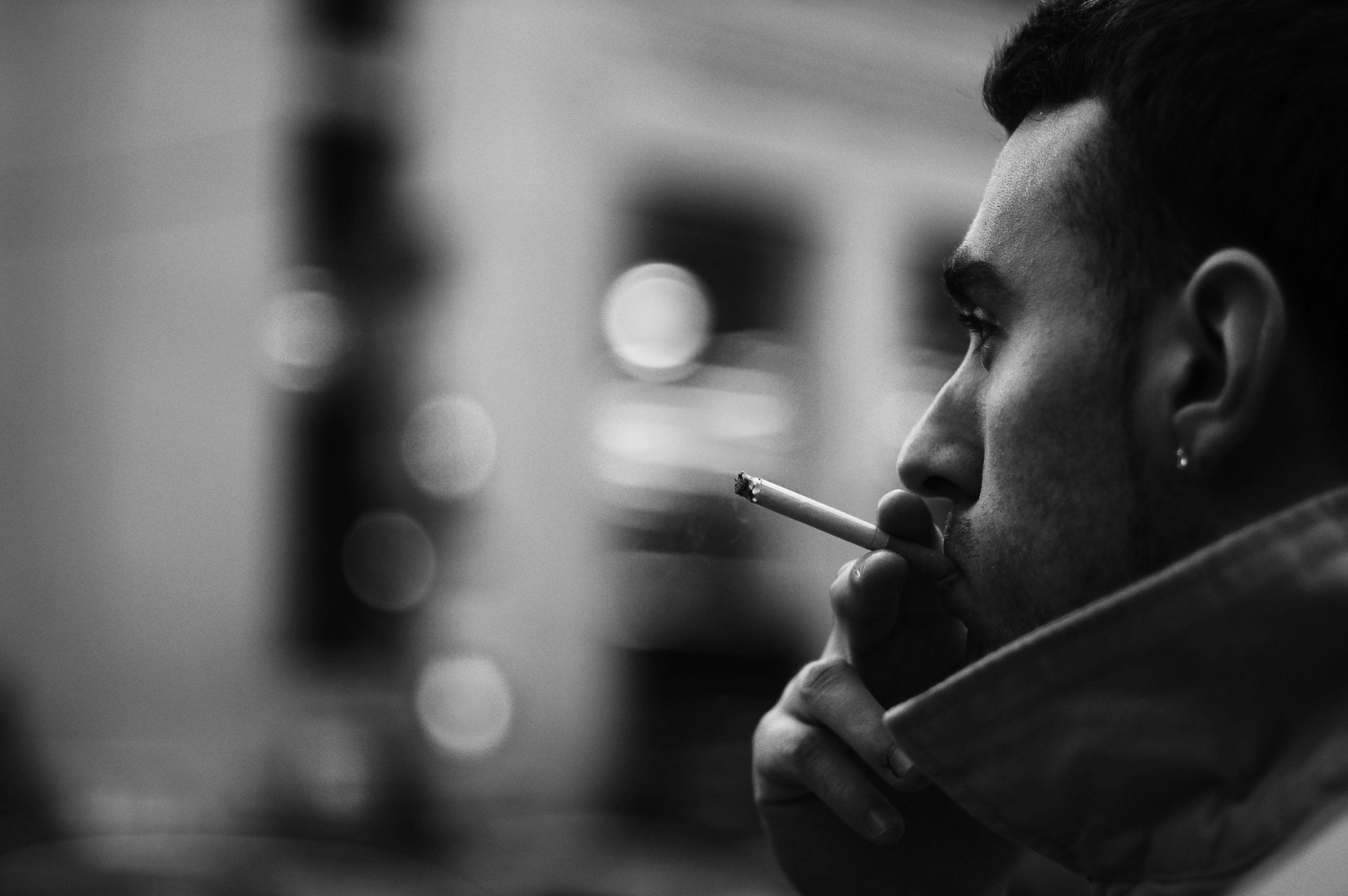 Grayscale photo of man smoking cigarette HD wallpaper