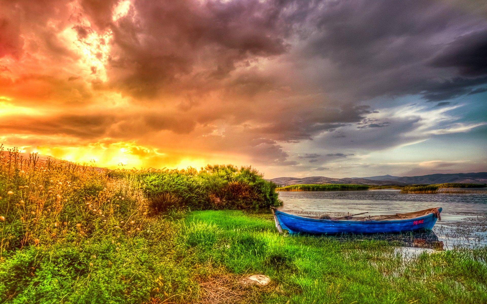 Canoe on the Lake at Sunset Full HD Wallpaper