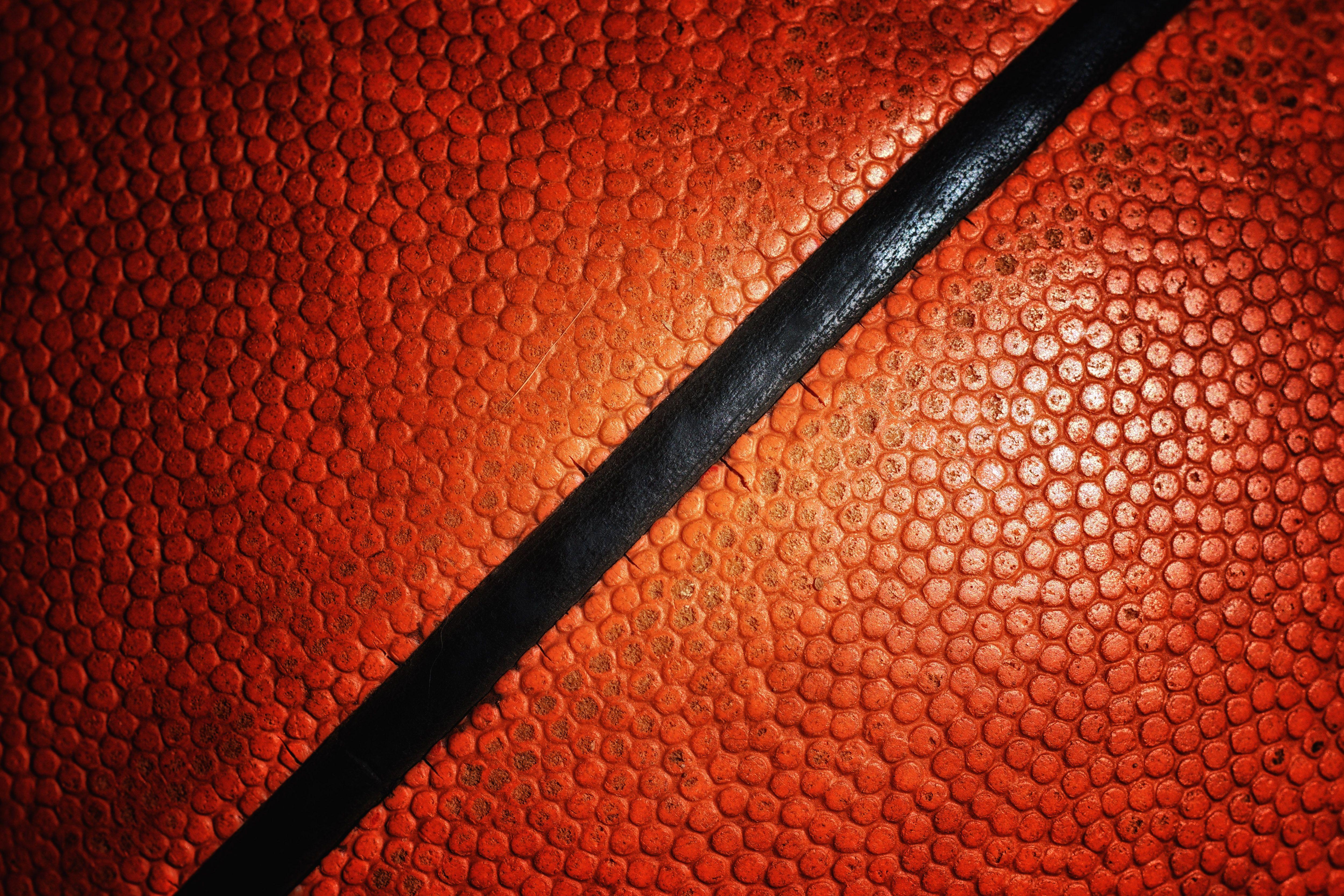 Three background image of an orange basketball texture