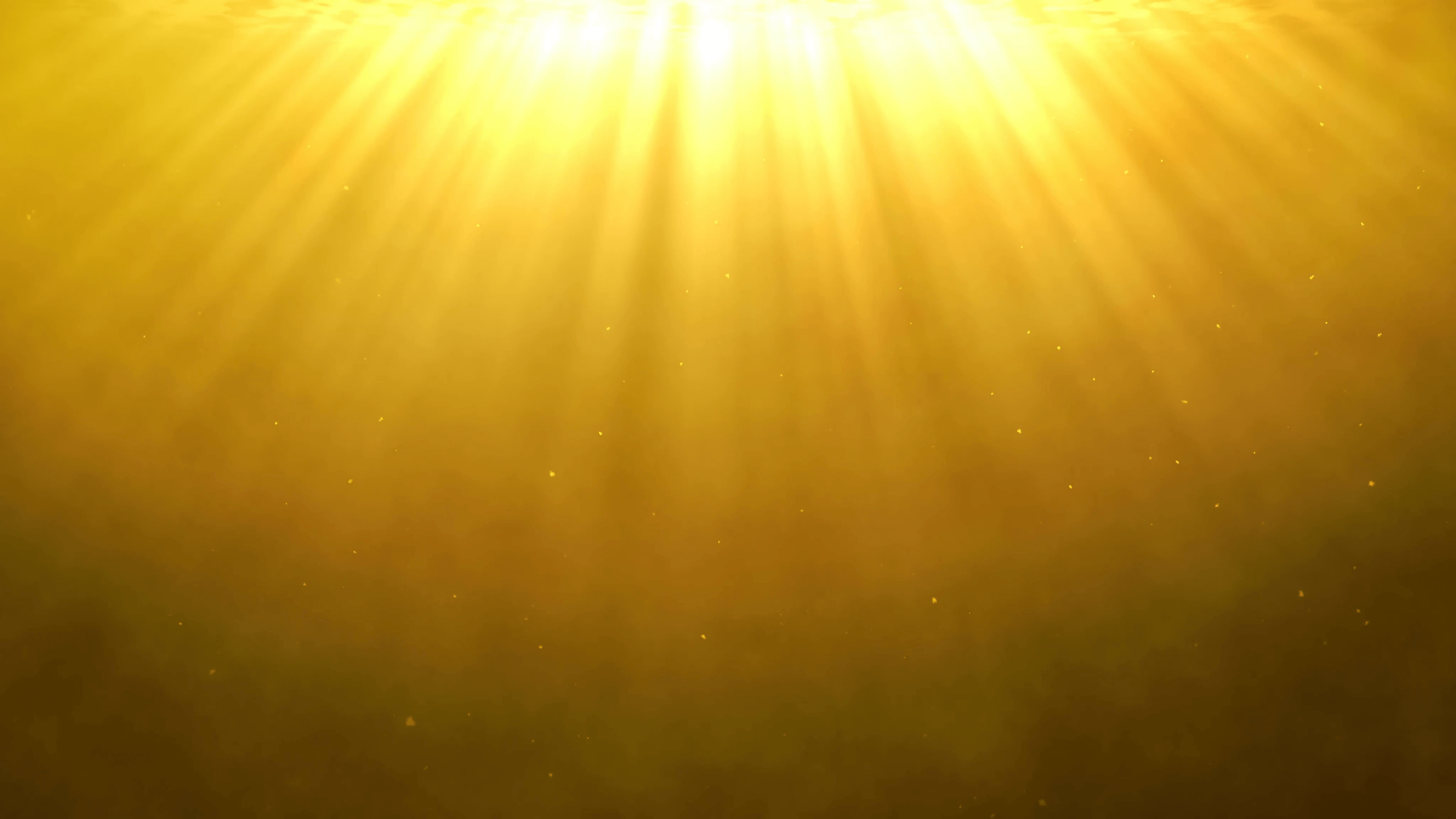 Divine light shining from above on a golden background with dust