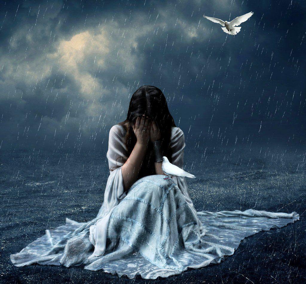 Lonely girl crying with tears in rain thinking of forgotten love