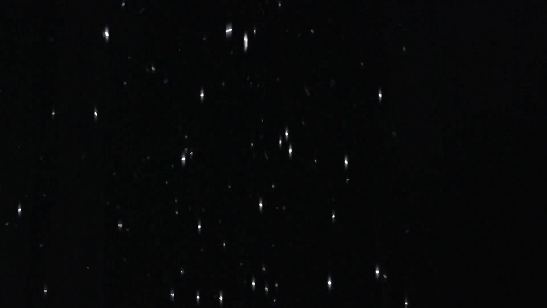 Glitter falling on black background Stock Video Footage