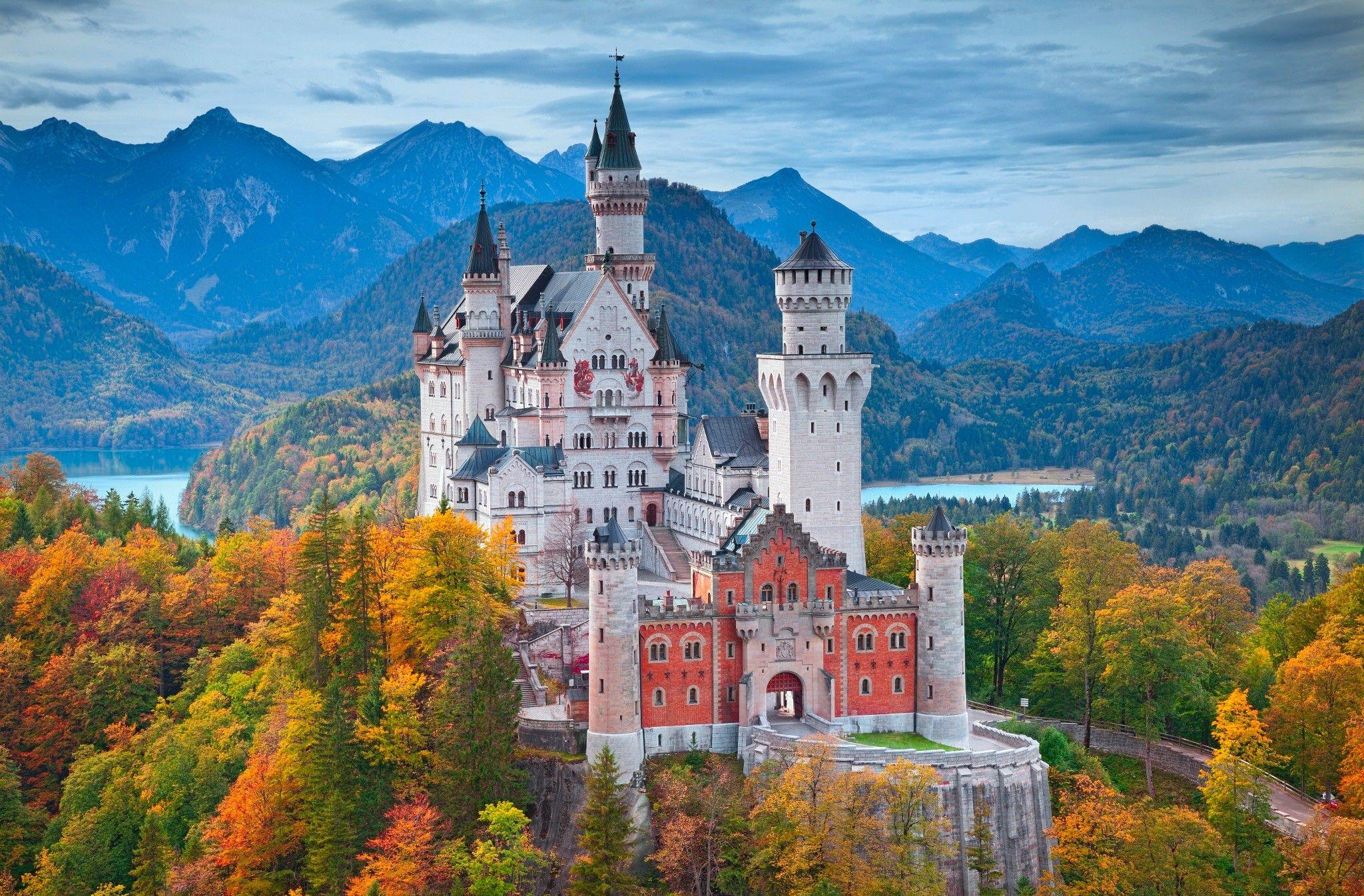 Neuschwastein Castle surrounded with autumn colours HD Wallpaper