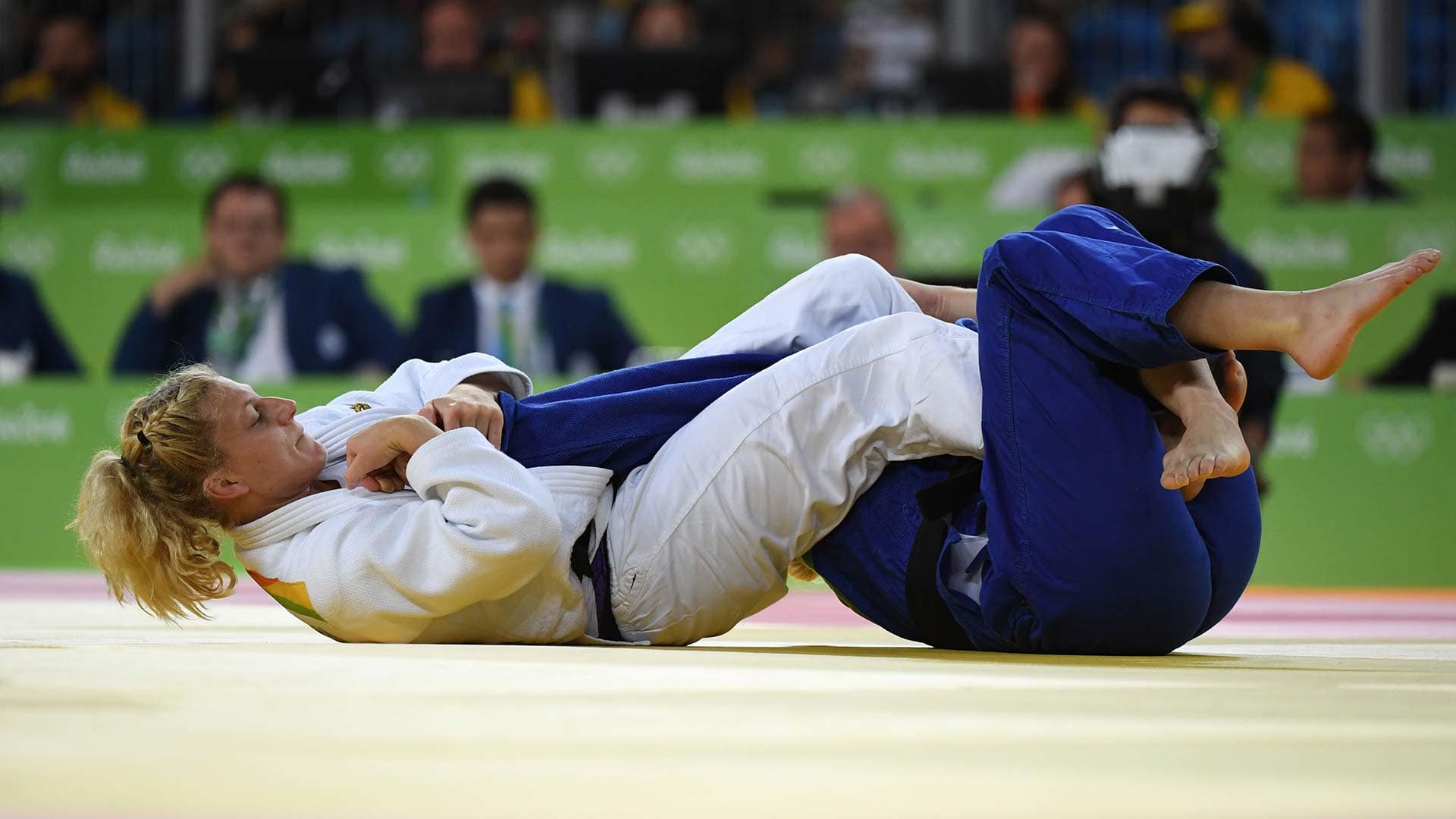 Kayla Harrison clinches Olympic medal with armbar submission. NBC