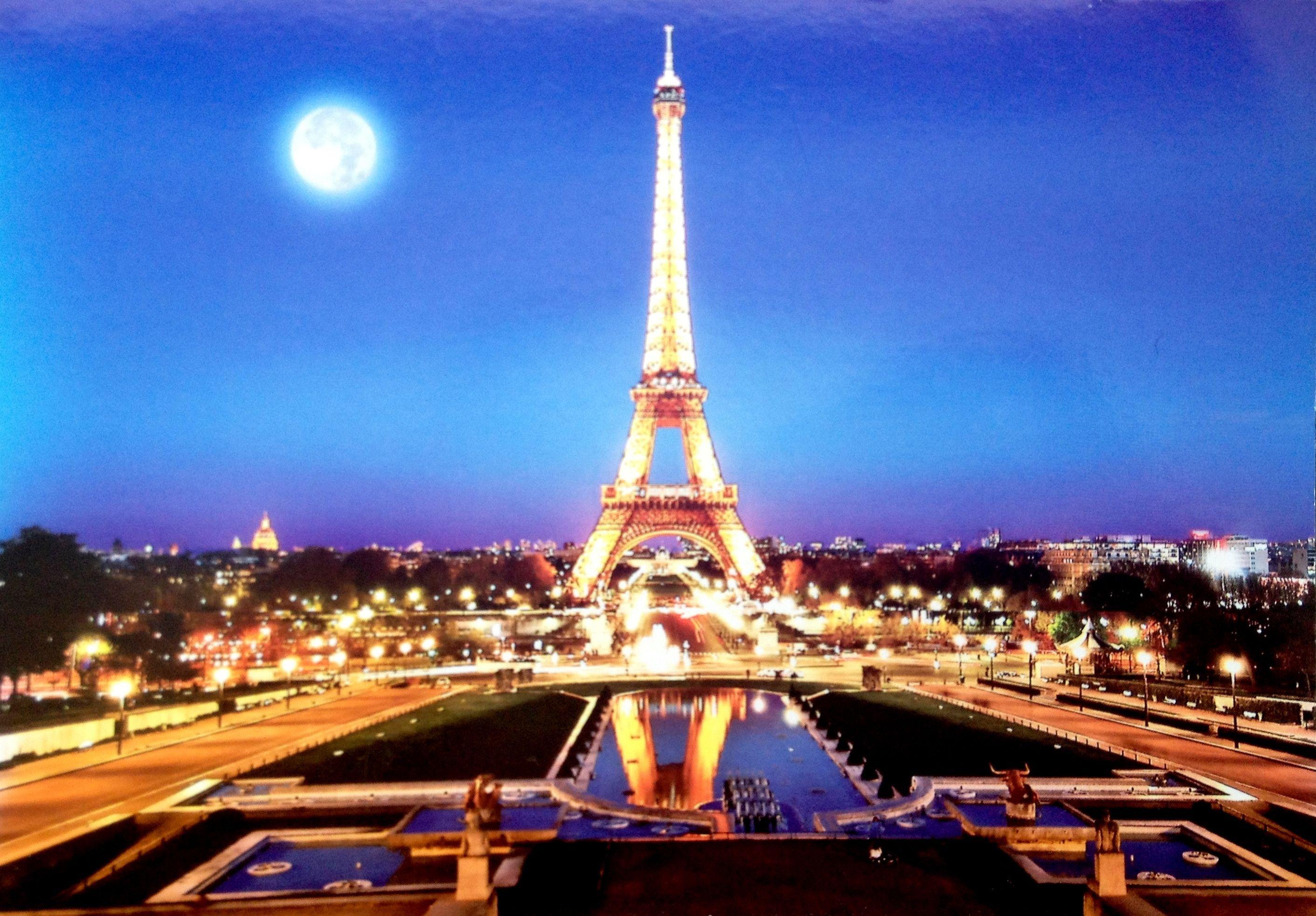 Eiffel Tower At Night With The Moon
