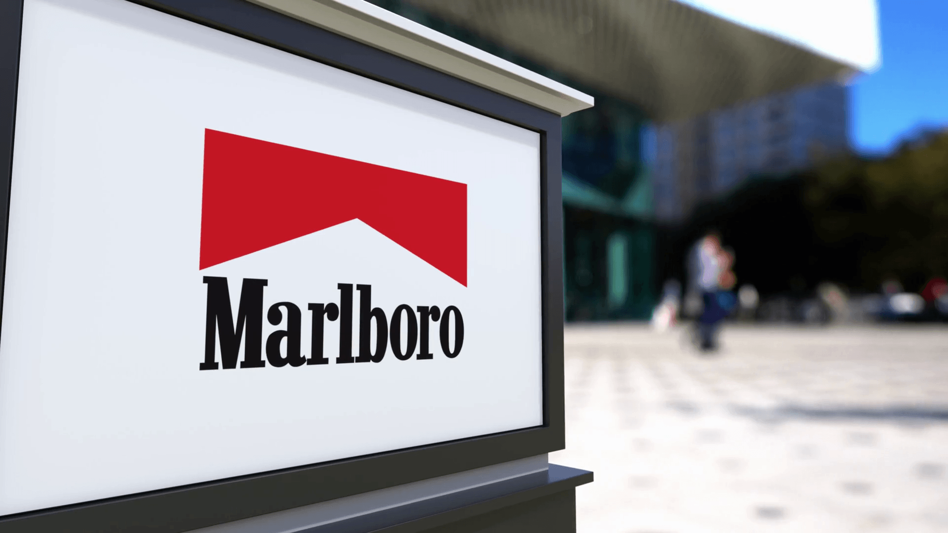 Street signage board with Marlboro logo. Blurred office center