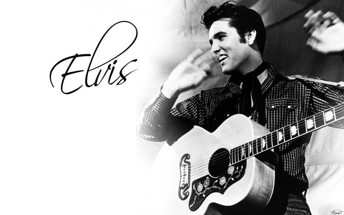 Elvis Presley with his guitar American singer