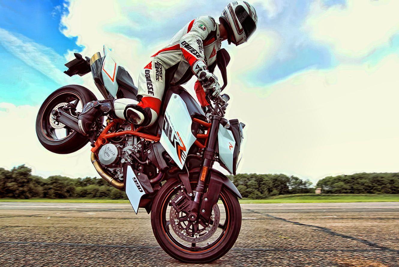 Motorcycle racer doing motorcycle stunt HD wallpaper