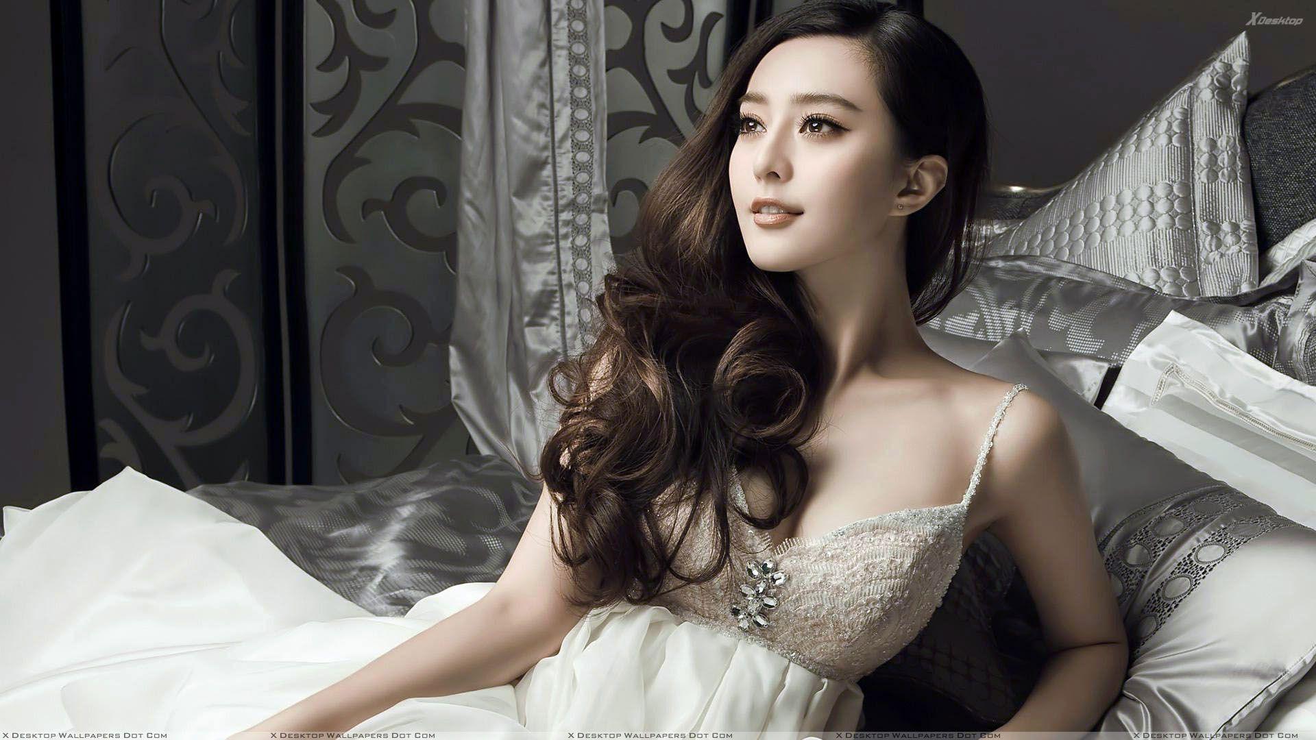 Fan Bingbing Cute Sitting Pose In White Long Dress Wallpaper