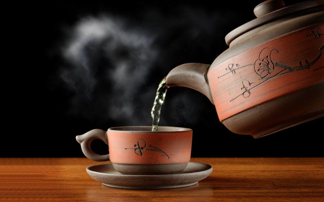 Hot tea in special brown cup
