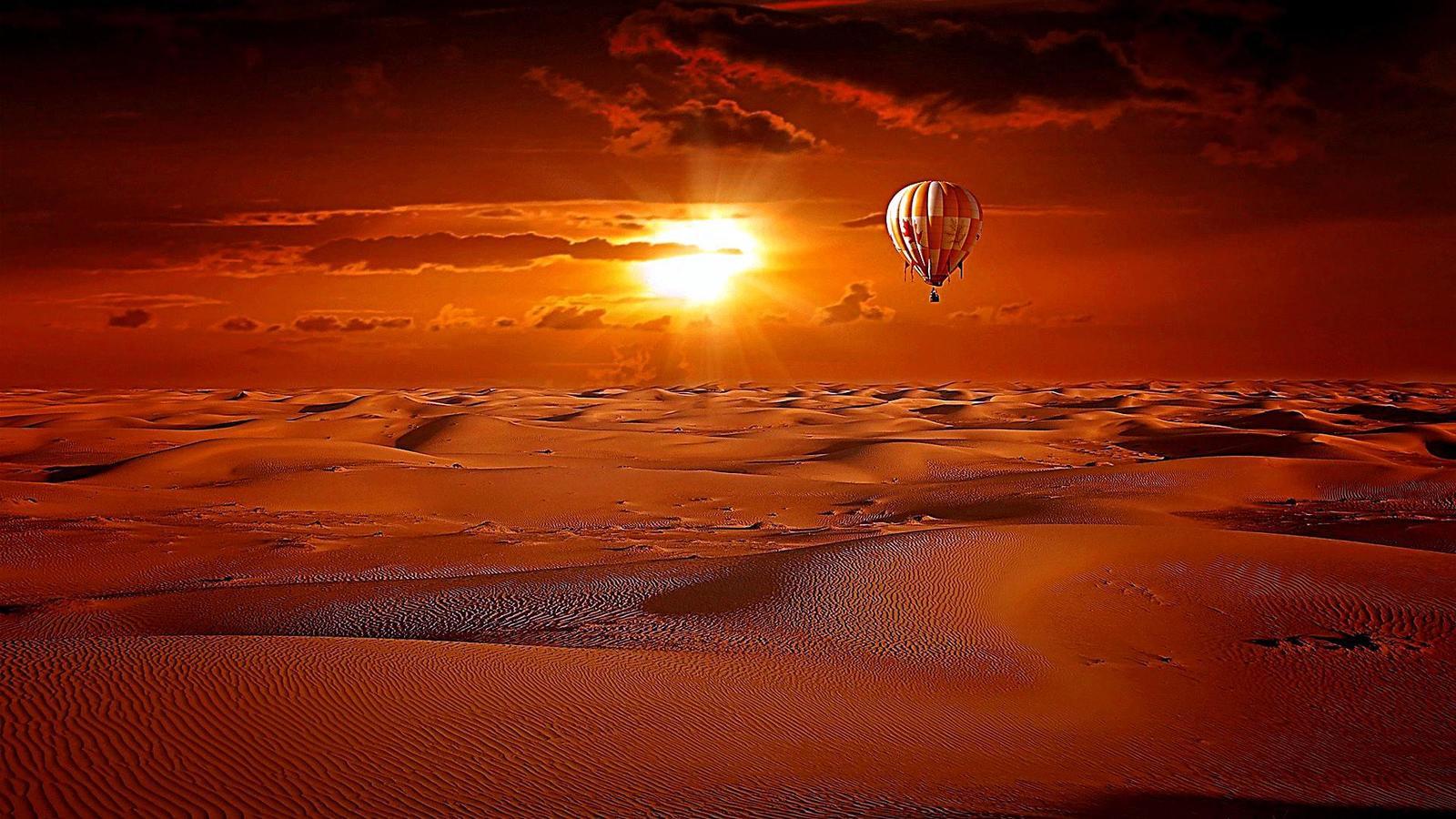 Hot Air Balloon Above The Desert In The Sunrise Wallpaper