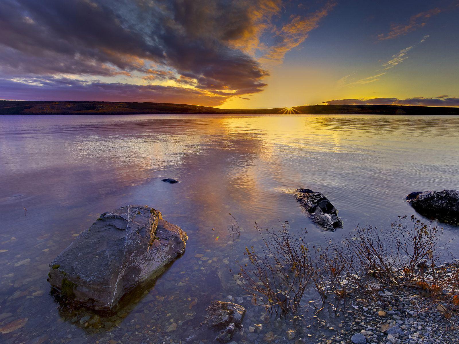 Sunset Mirrors in the Waters of Gander Lake Newfoundland. HD