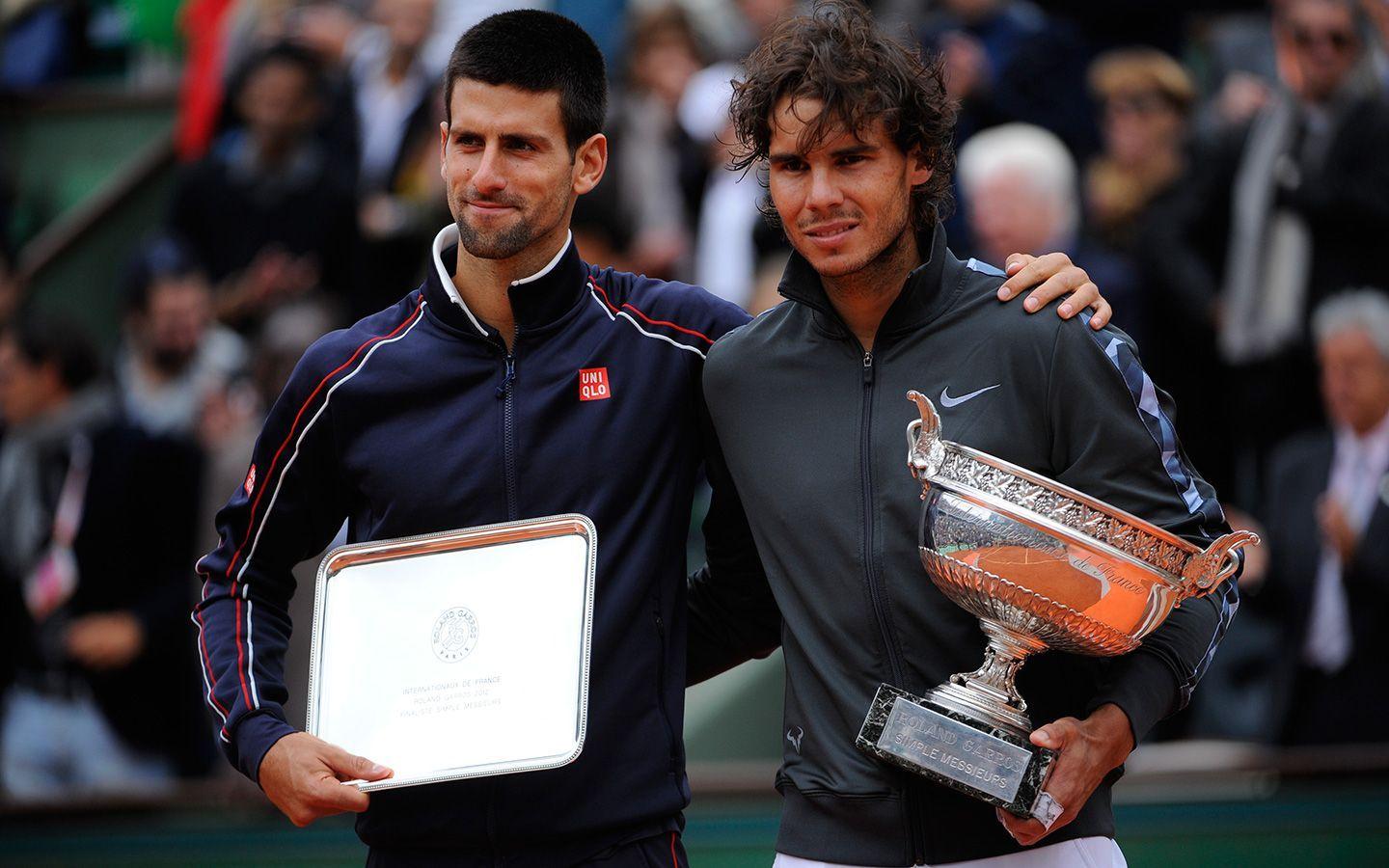Rafael Nadal and Novak Djokovic pose for the photographers after