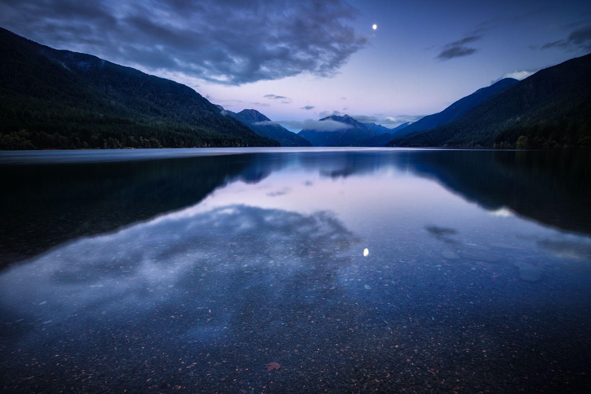 Mountain lake water surface night blue lilac sky clouds moon