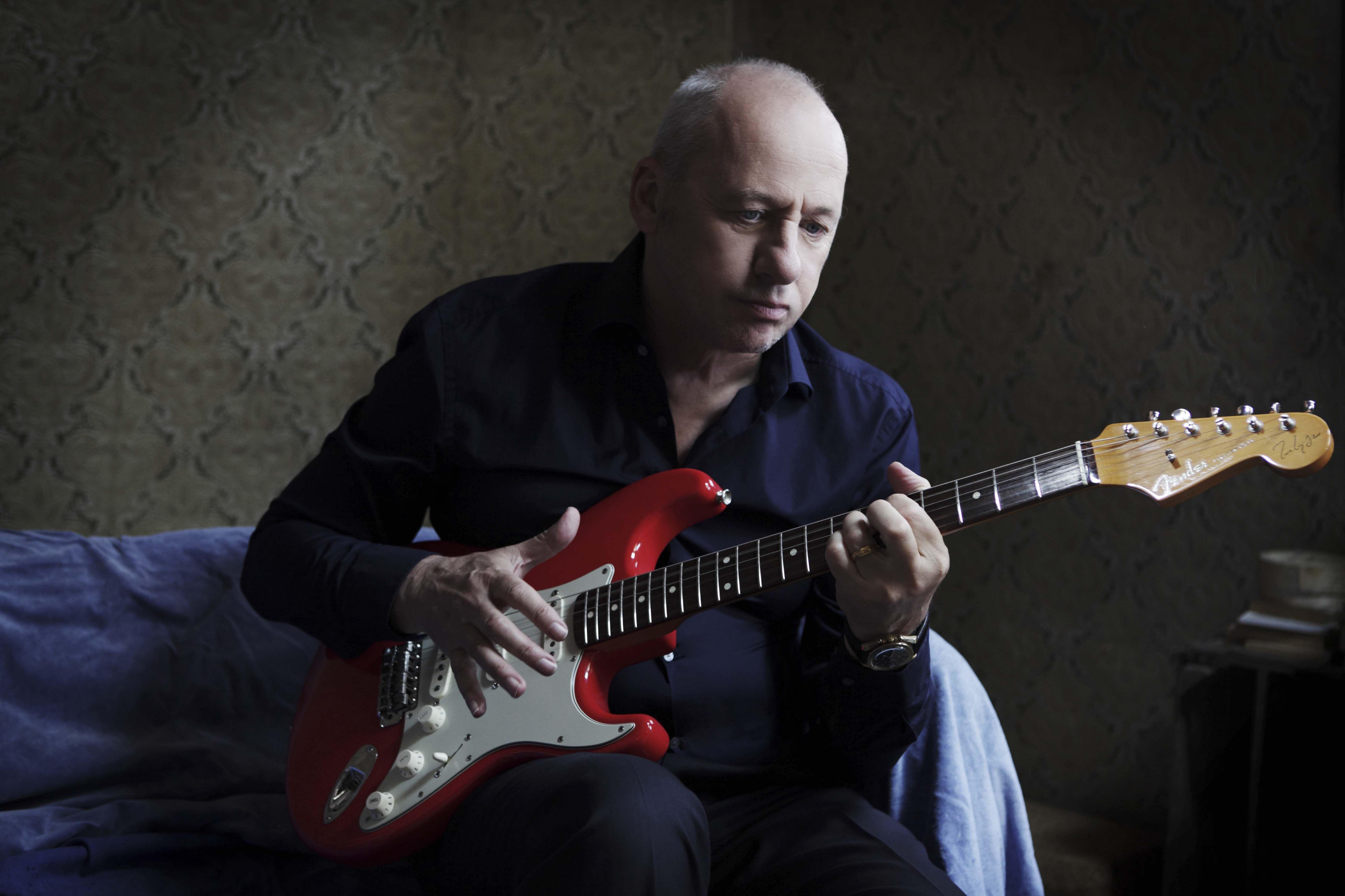 Mark Knopfler with his signature cherry red strat. Favorite