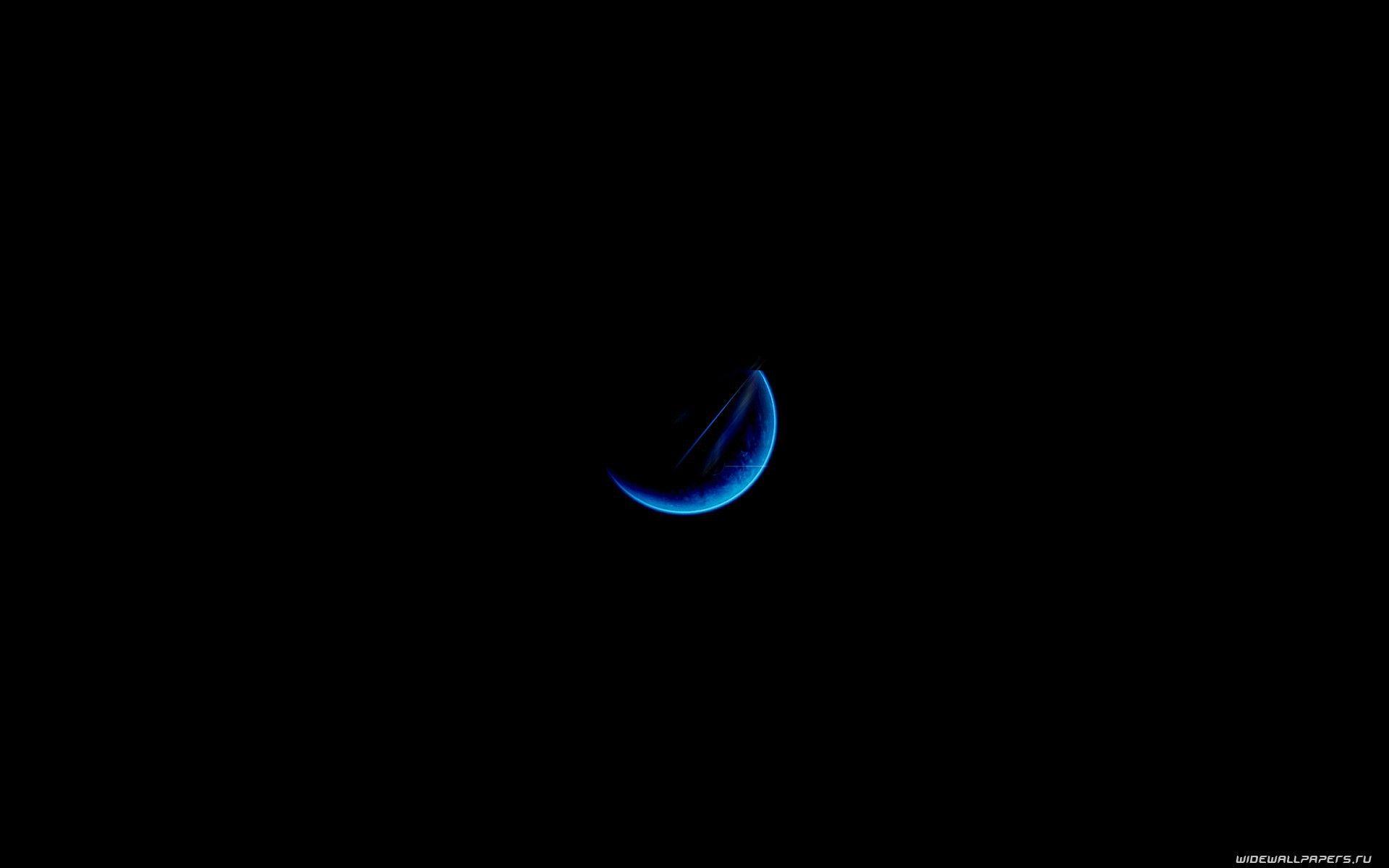 Half a blue moon on a black background wallpaper and image