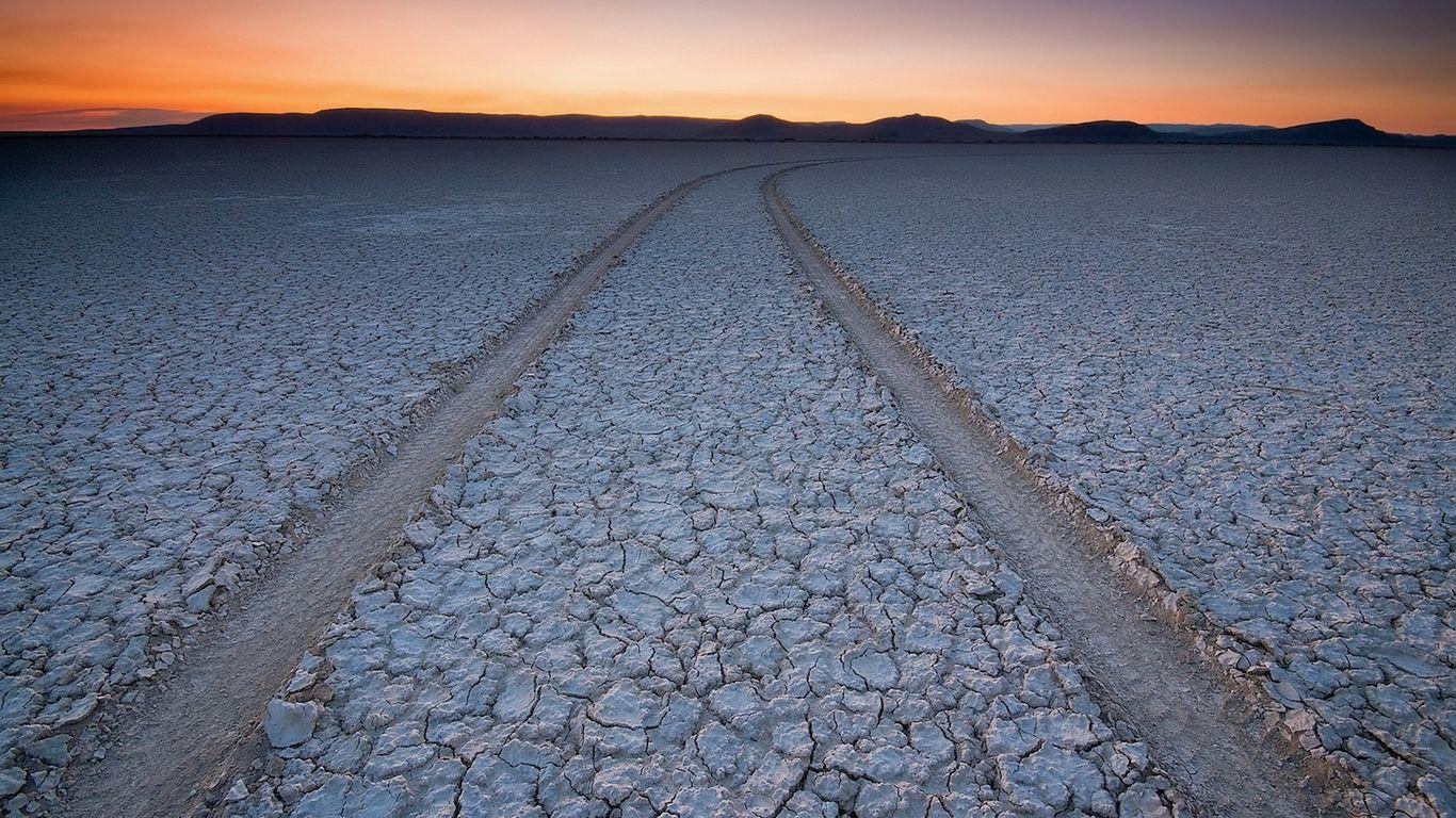 Download wallpaper 1366x768 protector, trace, earth, drought, cracks