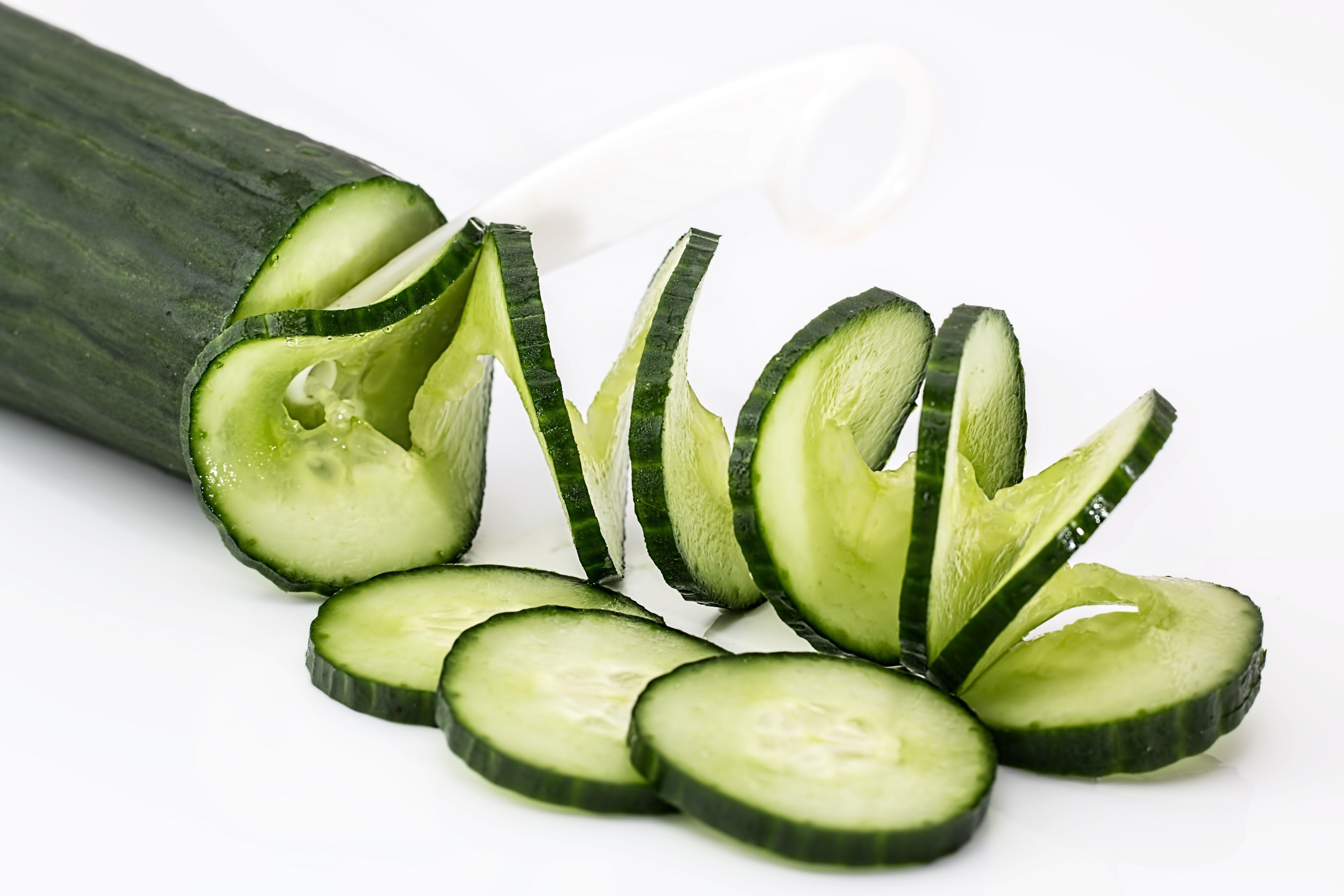 Sliced Cucumber on White Table · Free