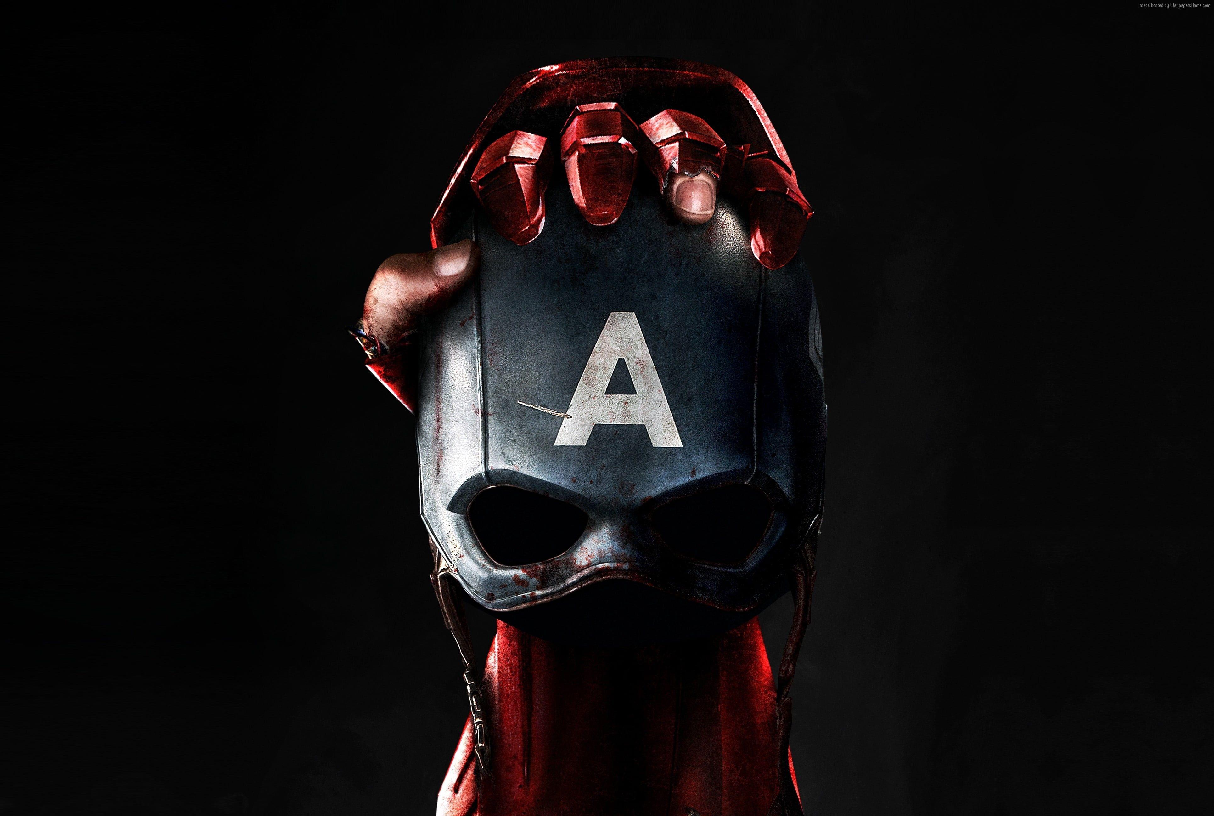 Iron Man holding Captain America Mask digital wallpaper HD wallpaper