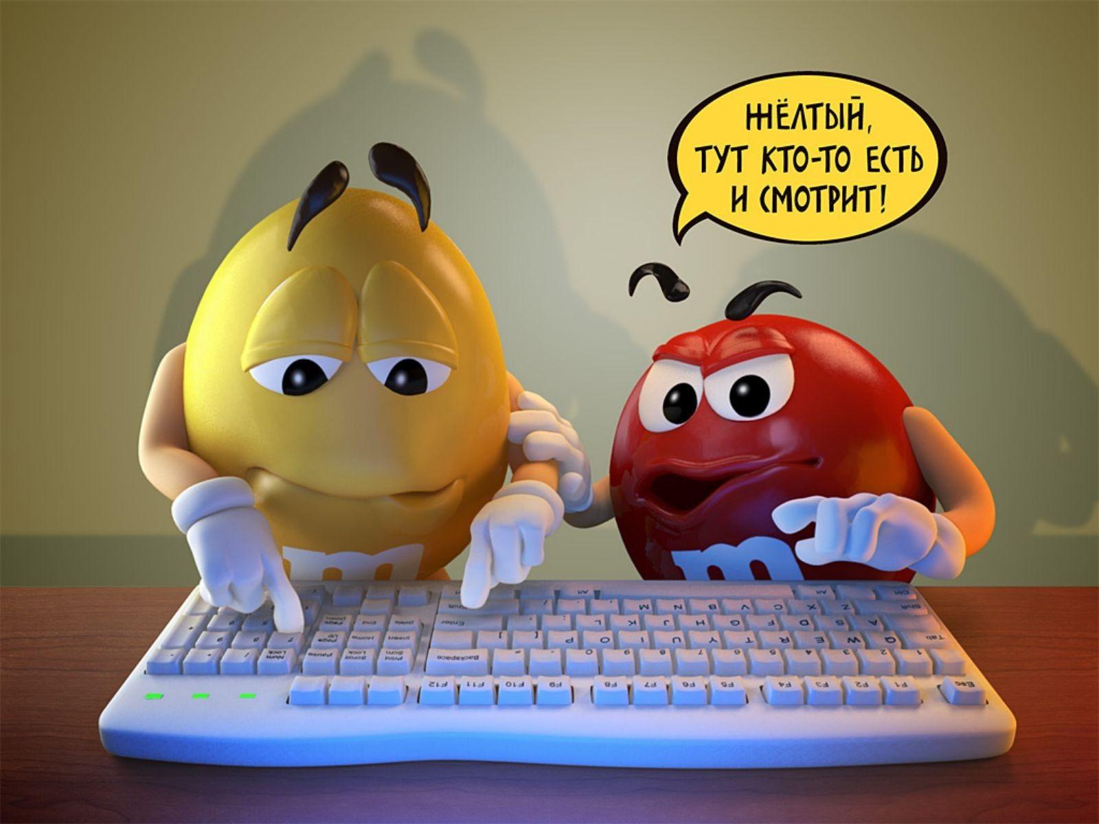 Two candy M&Ms typing on a keyboard. Android wallpaper for free