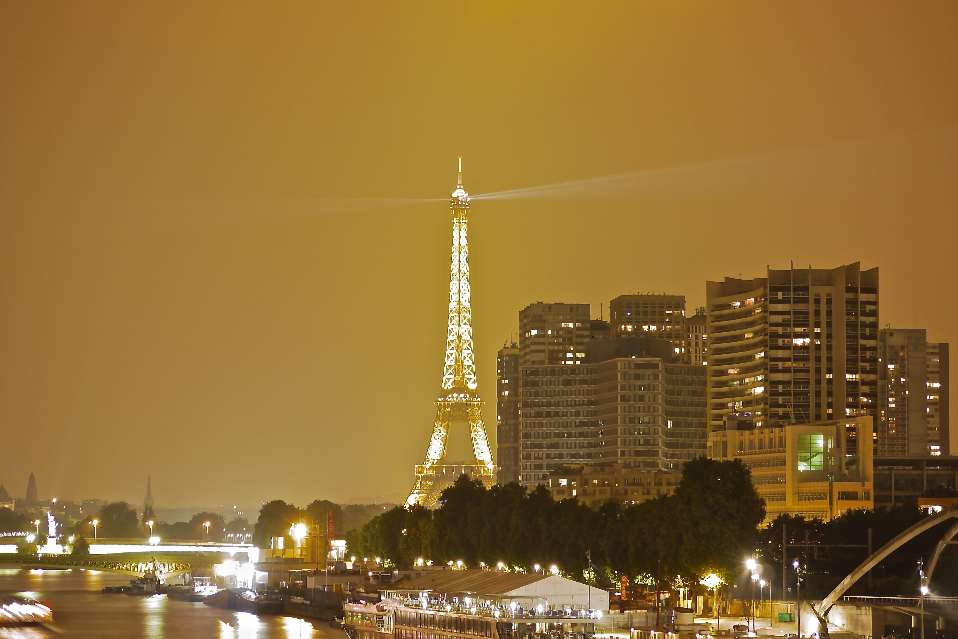 Eiffel tower during night time HD wallpaper