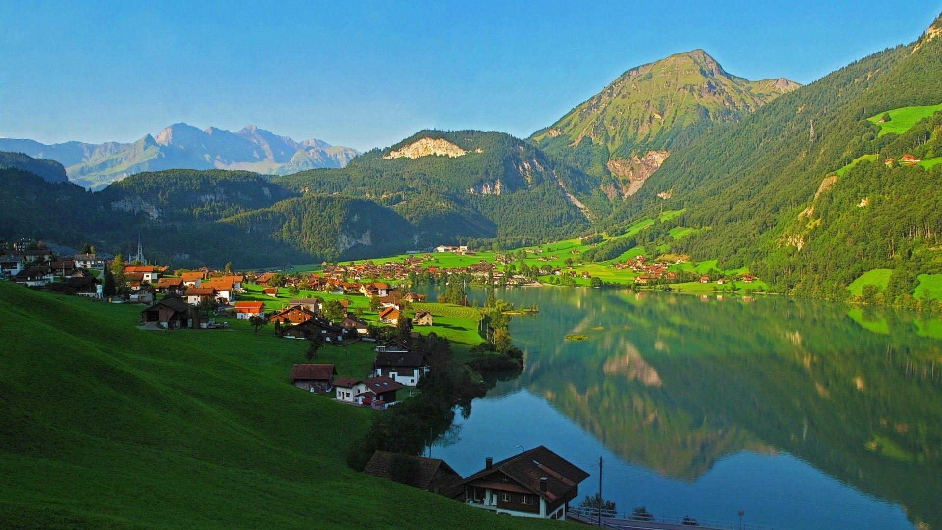 Fantastic village on an alpine lake wallpaper