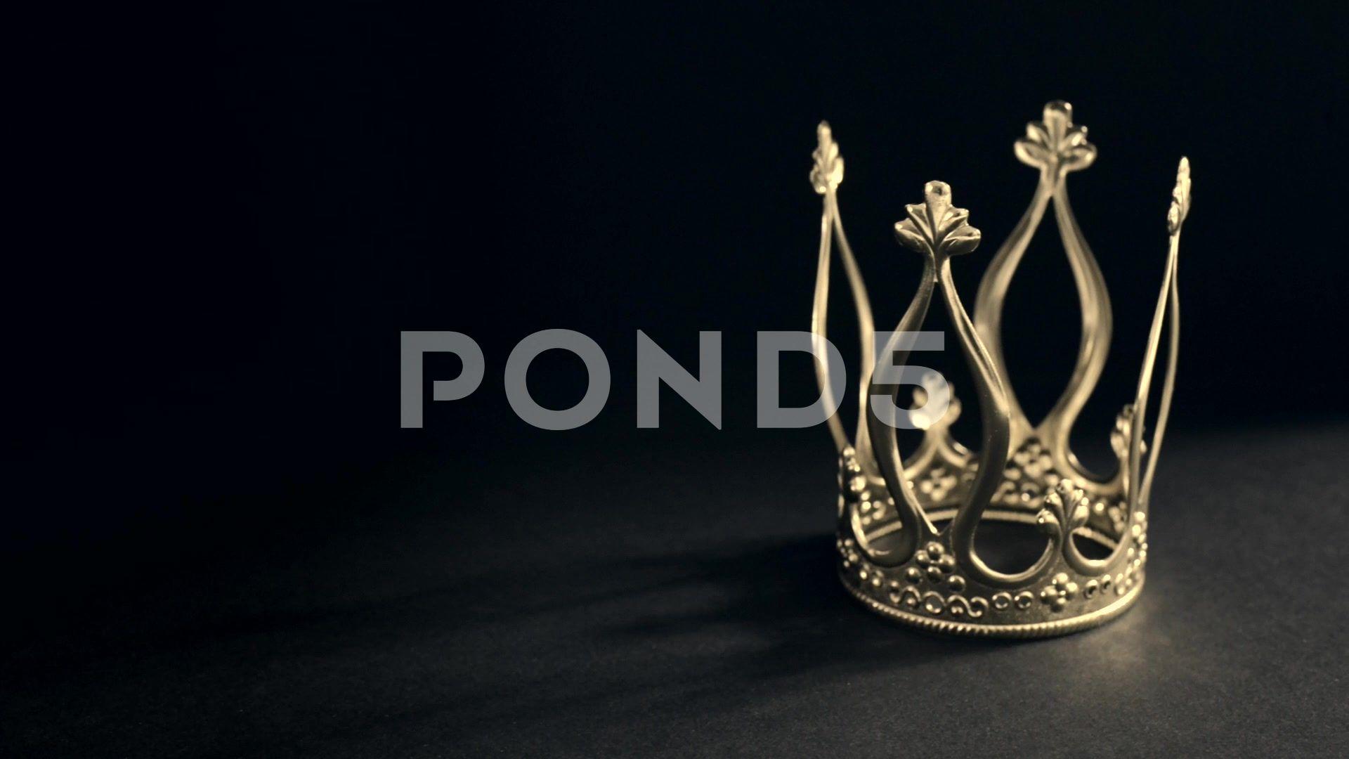 Royal gold crown on black background Hi Res