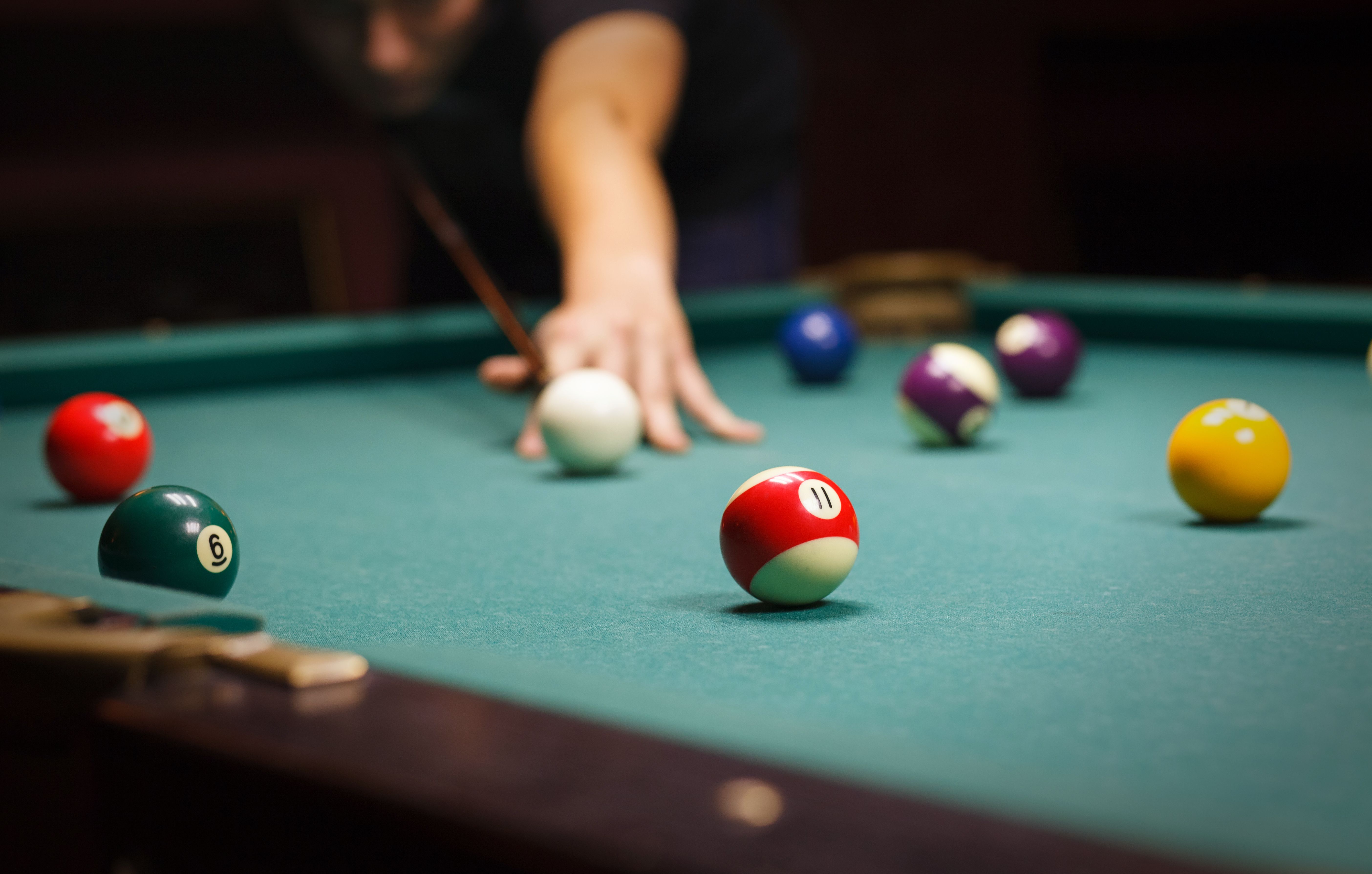 man playing billiard Coast Life