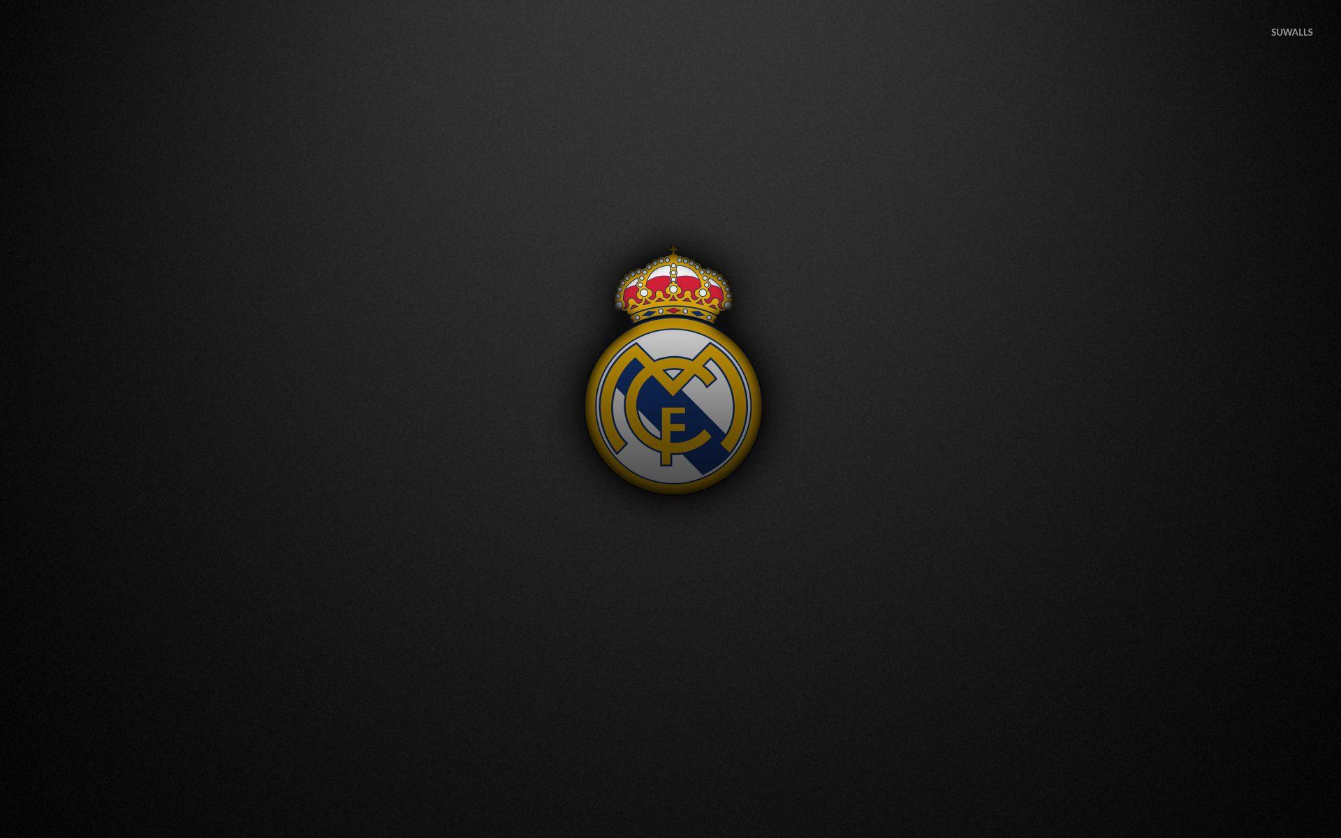 Real Madrid C.F. logo on a black texture background wallpaper