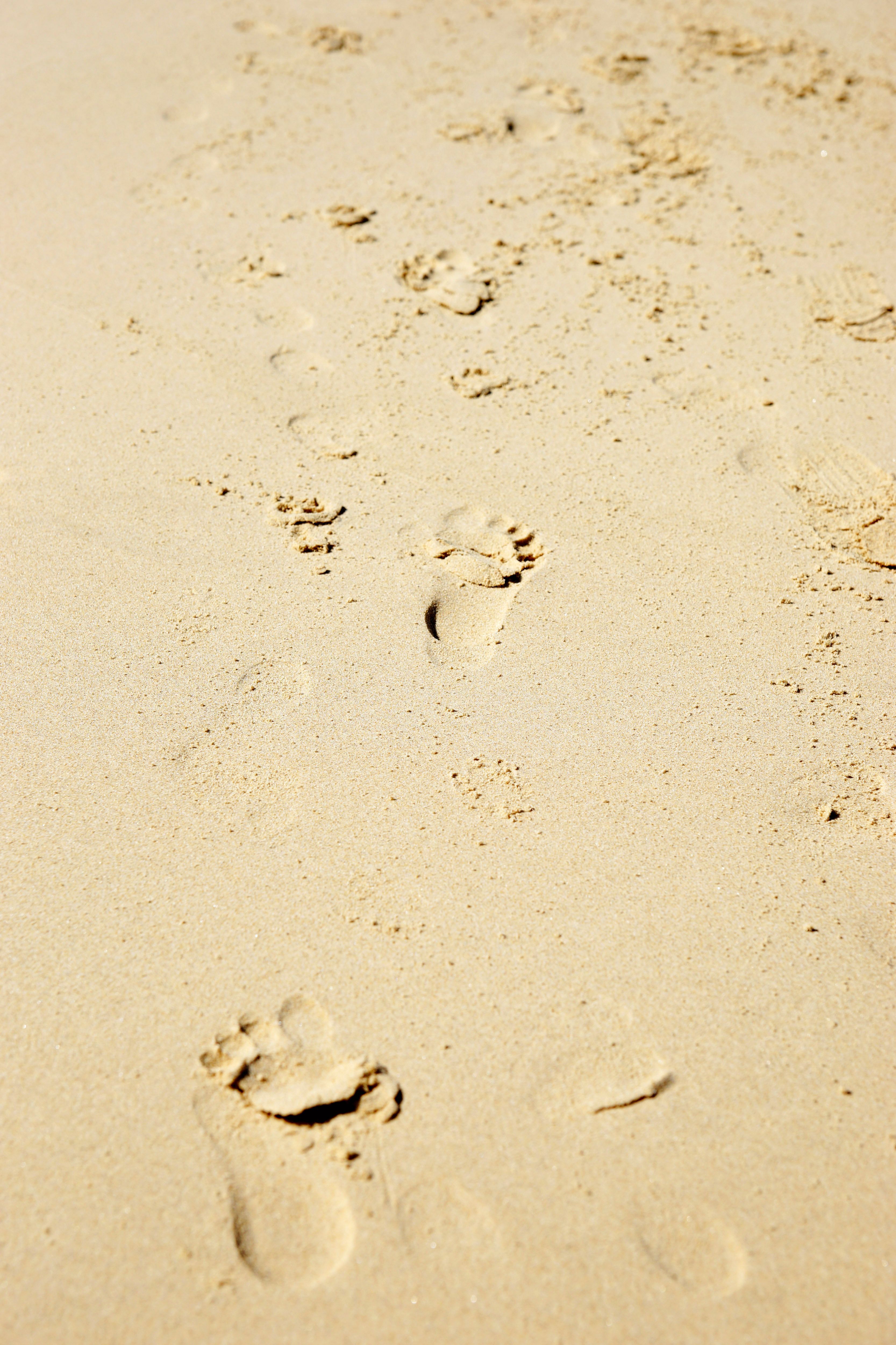 Two more background photo of footprints in the sand