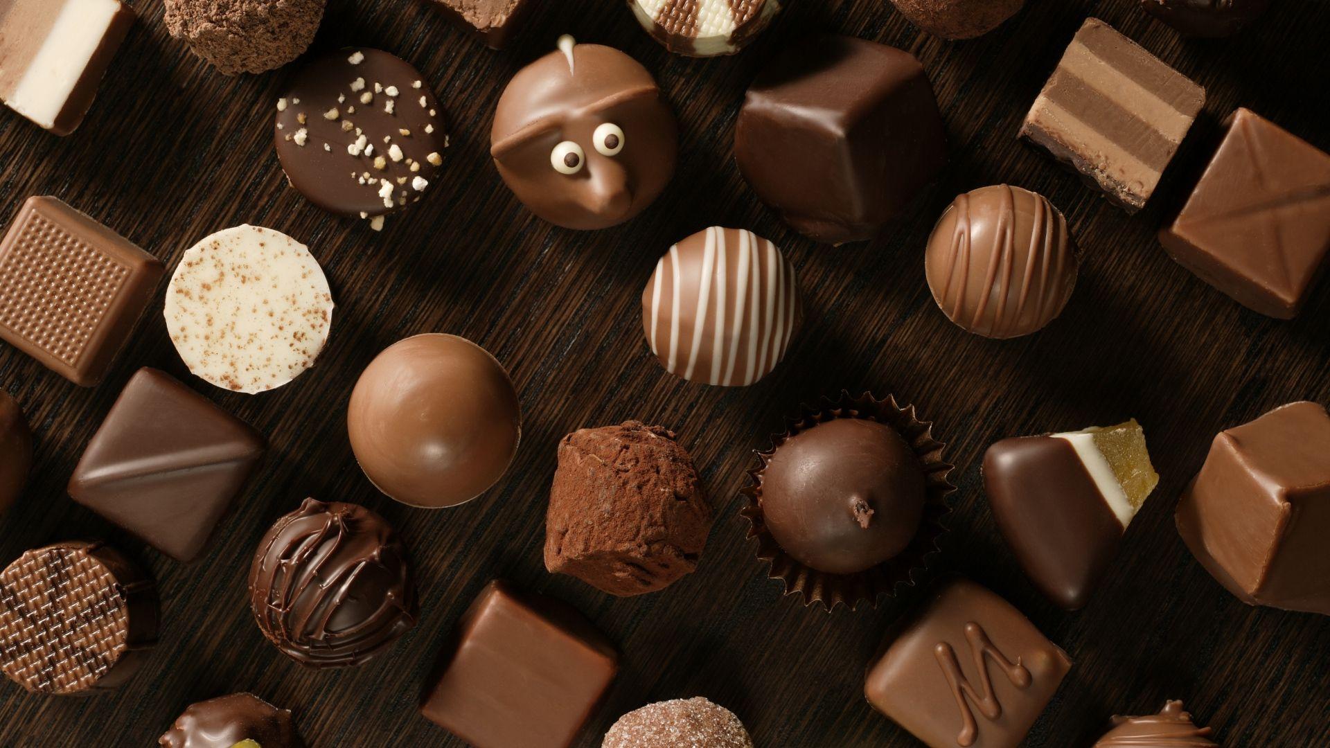 Download Wallpaper 1920x1080 chocolate, candies, table, allsorts