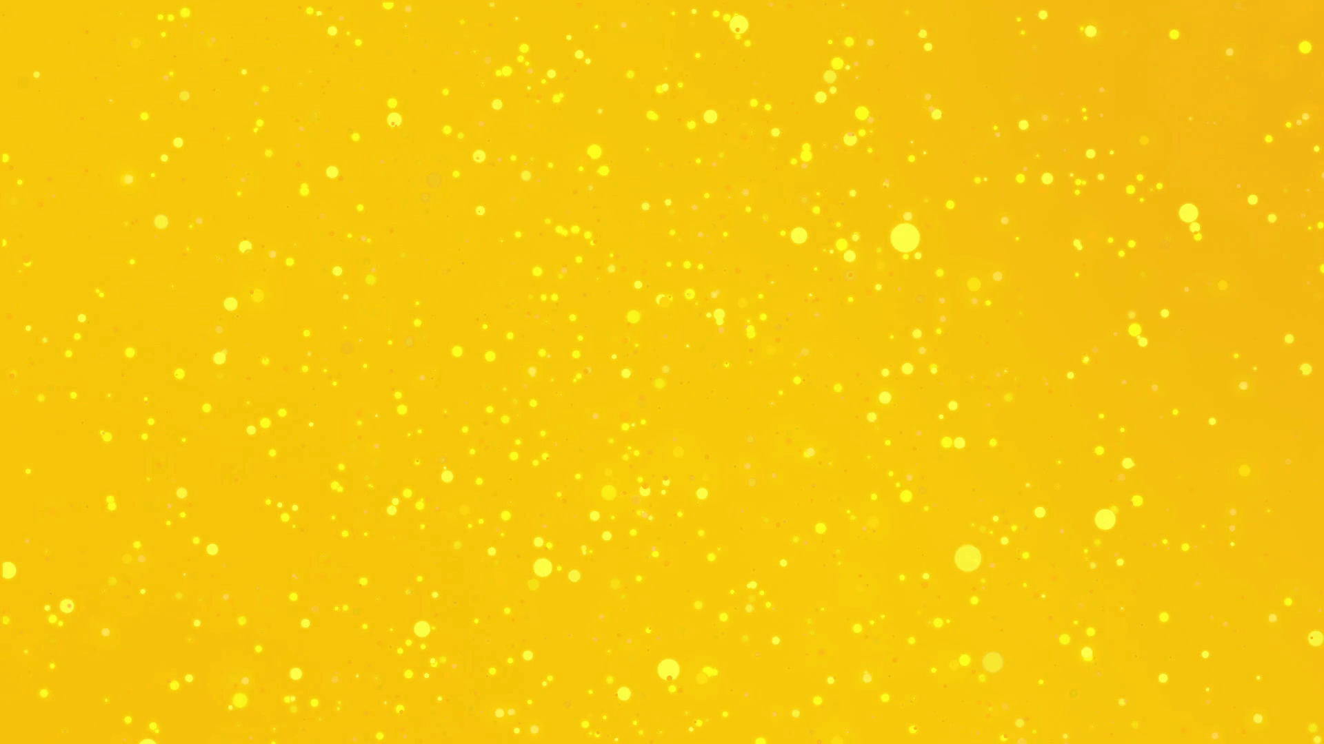 Beautiful festive golden yellow glitter background with flickering