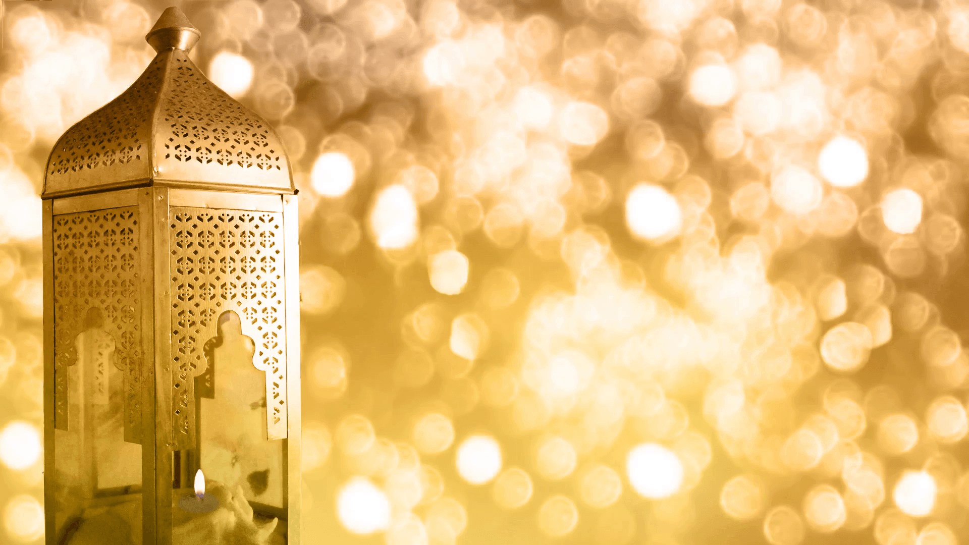 Arabic ornamental lantern with burning candle and glittering bokeh
