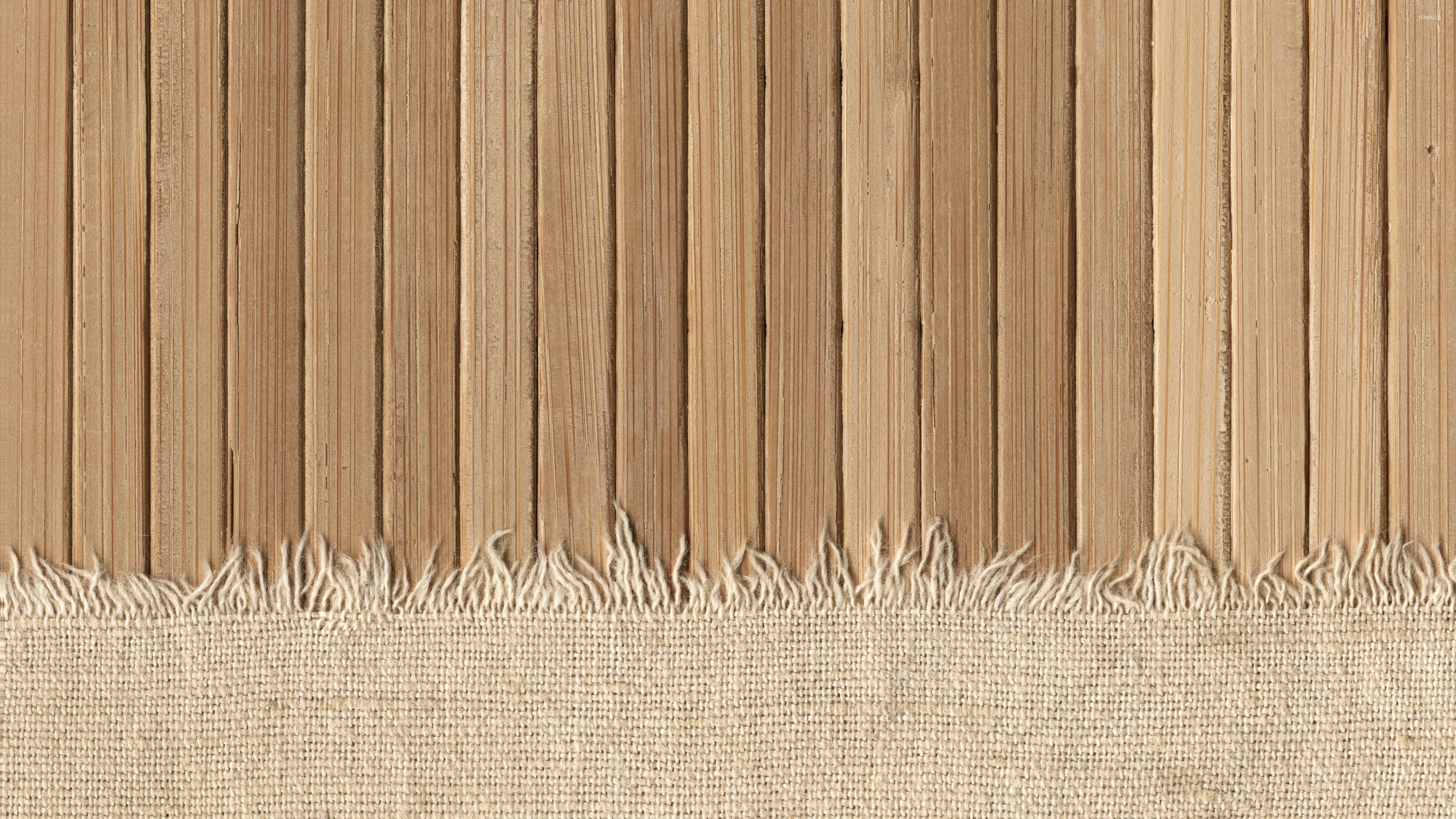 Knit fabric covering the wooden panels wallpaper