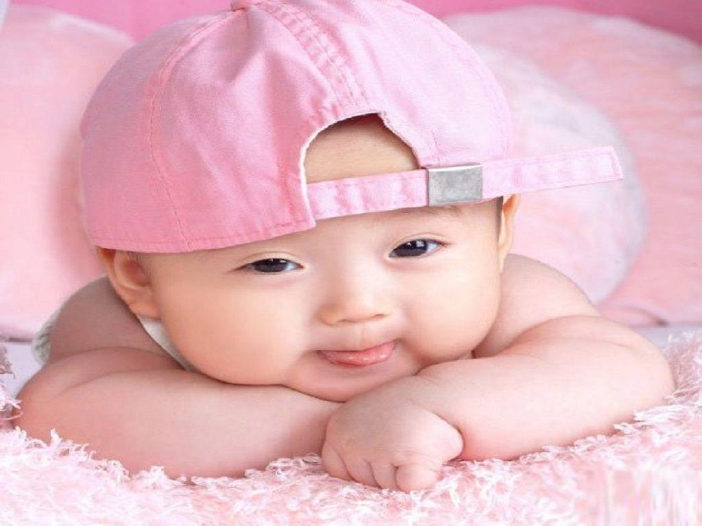 With Pink Cap Sweet Little Baby Wallpaper