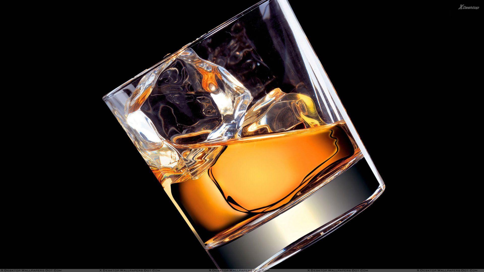 Whiskey In Glass Black Background Wallpaper