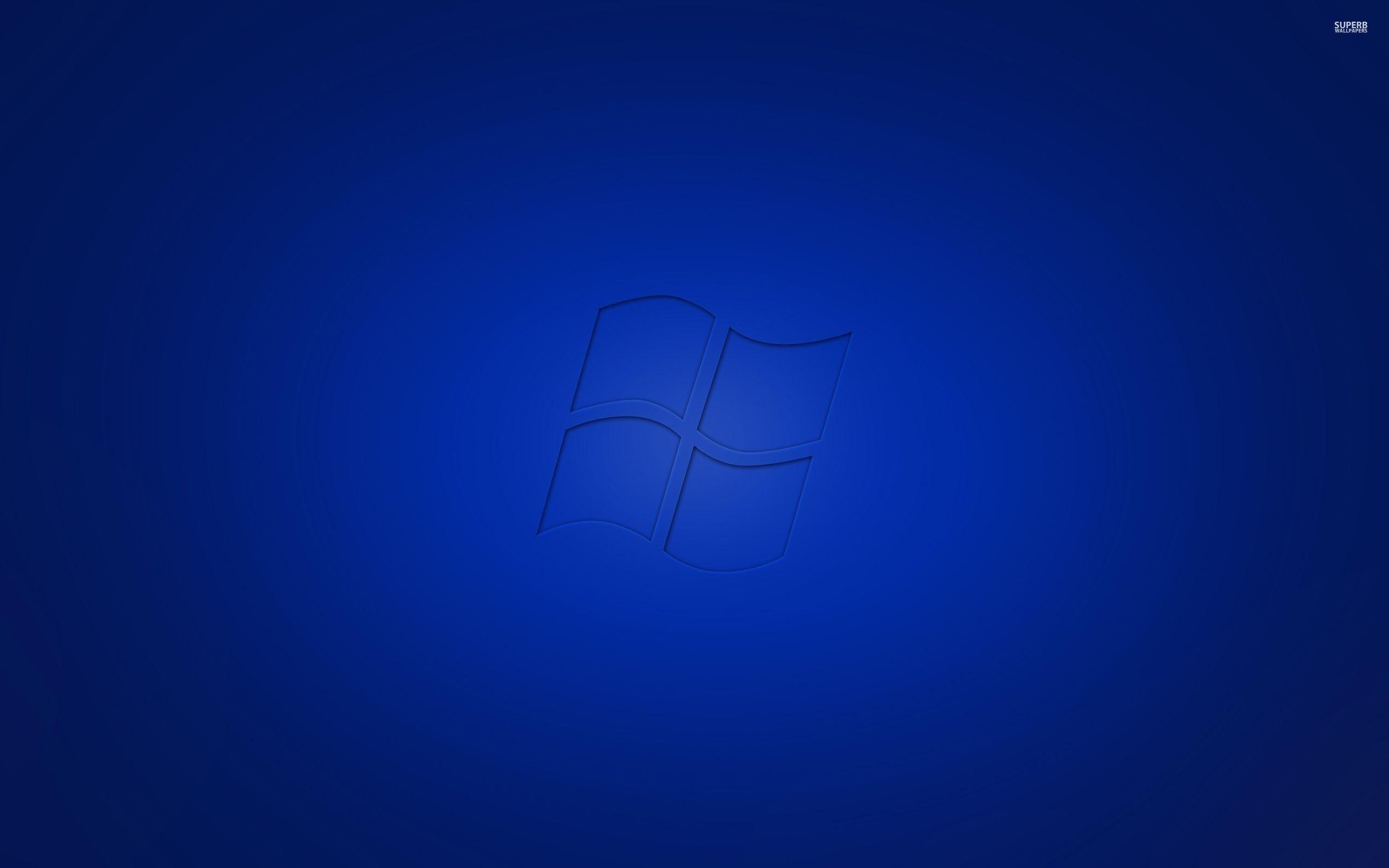 Blue Windows 7 printed on blue background wallpaper