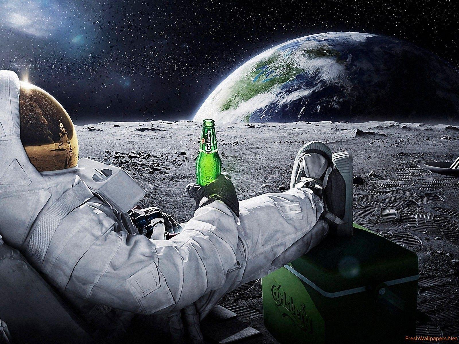 Astronaut having a beer on the moon wallpaper