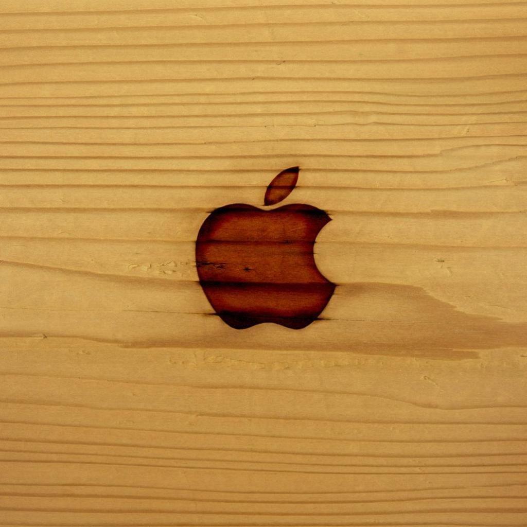 iWallpaper logo on wooden surface. iPad and iPhone wallpaper