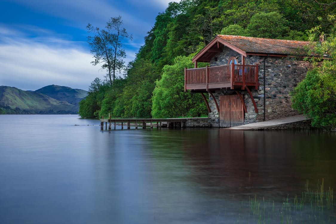 A Breathtaking Cottage Near The Lake Water Scenery Wallpaper