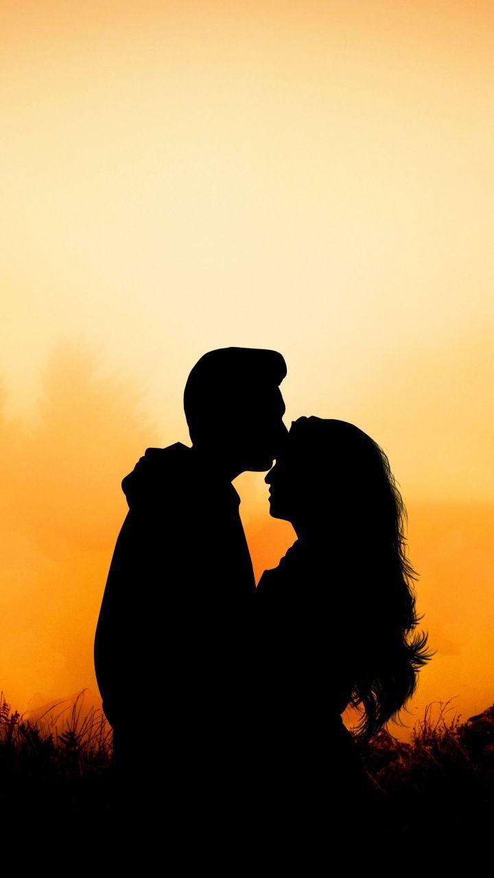Couple, hug, kiss, love, outdoor, sunset, 720x1280 wallpaper