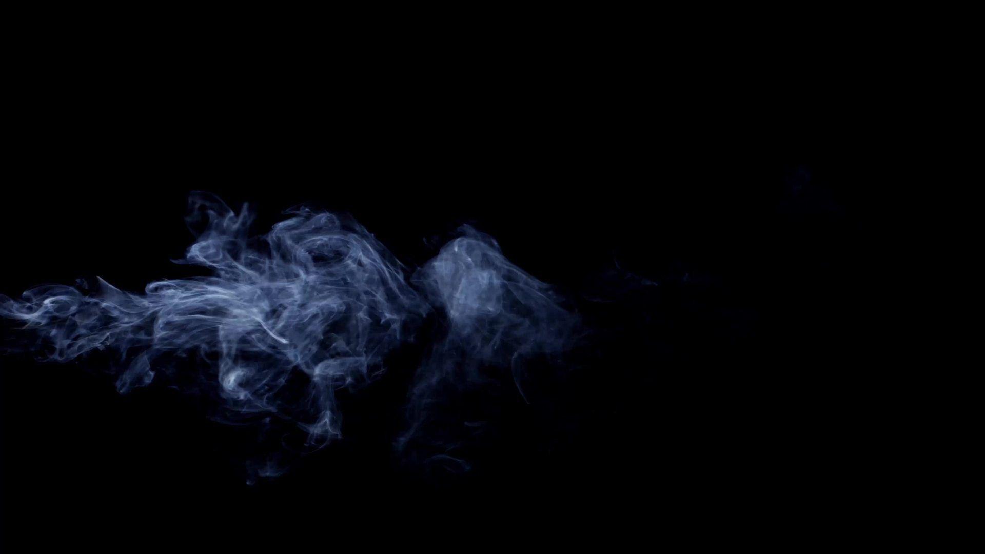 Awesome smoke effect moving slow and drawing spirals on dark