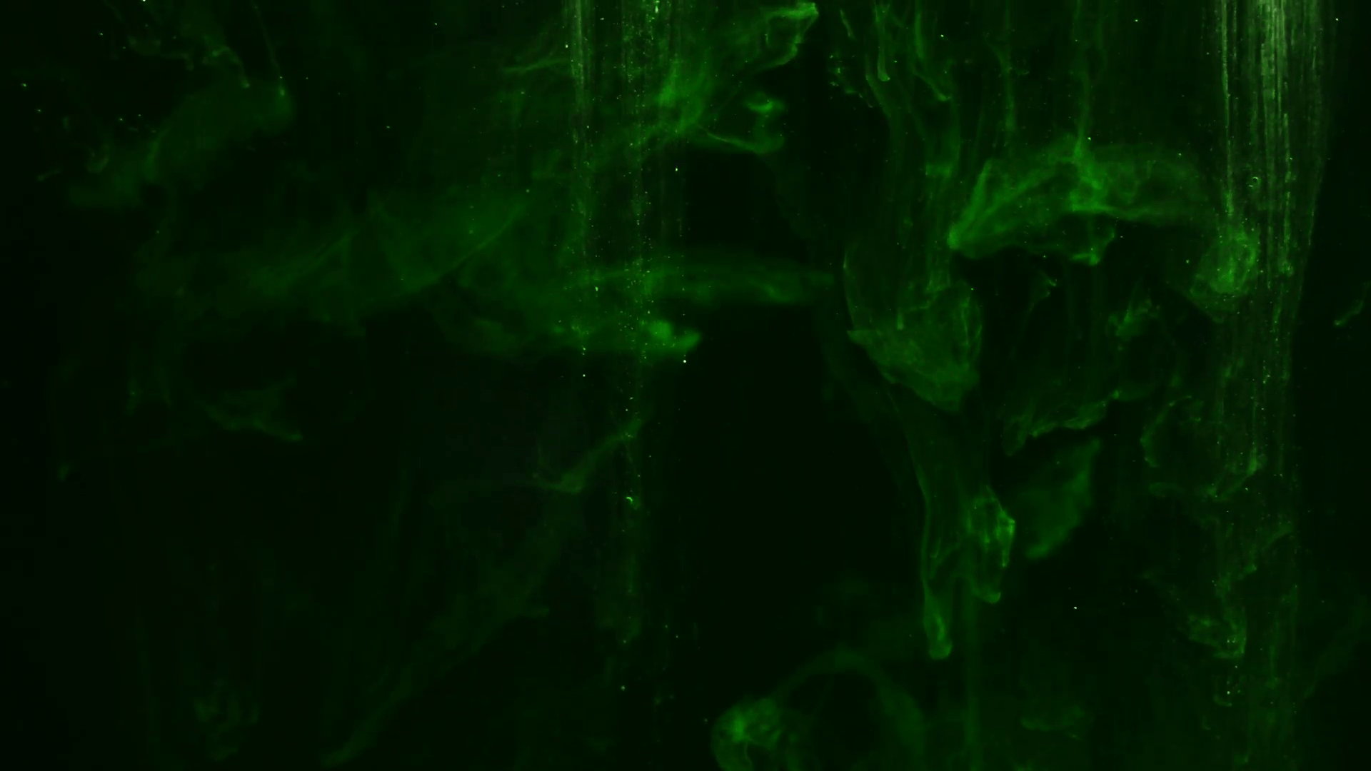 Abstract dark green abstract background, ink in water close up. Full