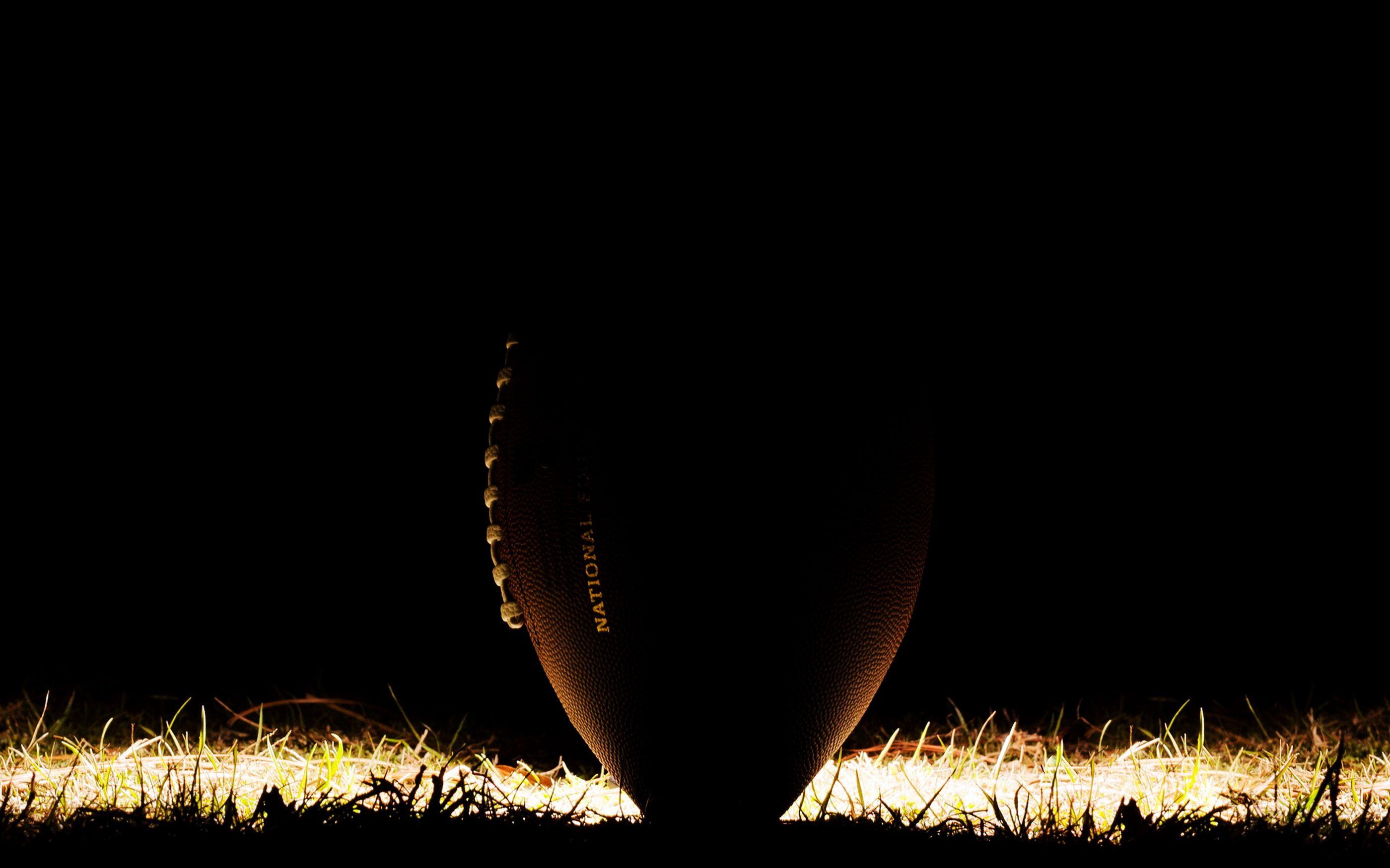 American Football Ball in Dark HD Wallpaper. MONSTER SPORTS DIRECTORY
