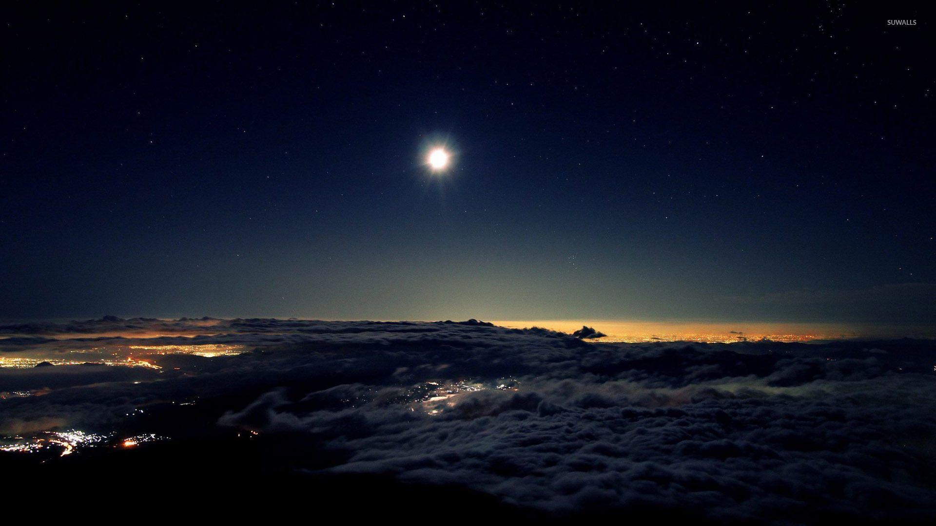Night sky above the clouds wallpaper wallpaper