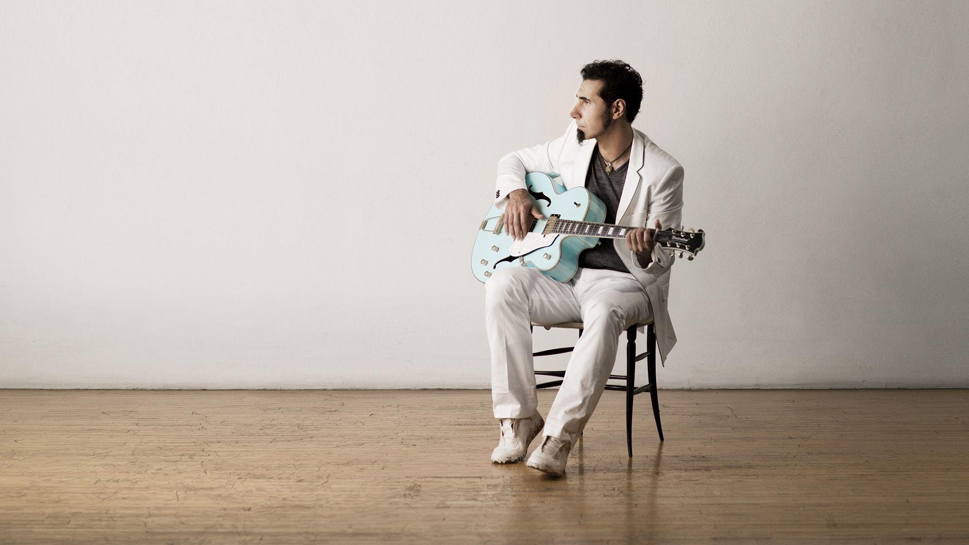 Download wallpaper 1920x1080 serj tankian, guitar, beard, chair